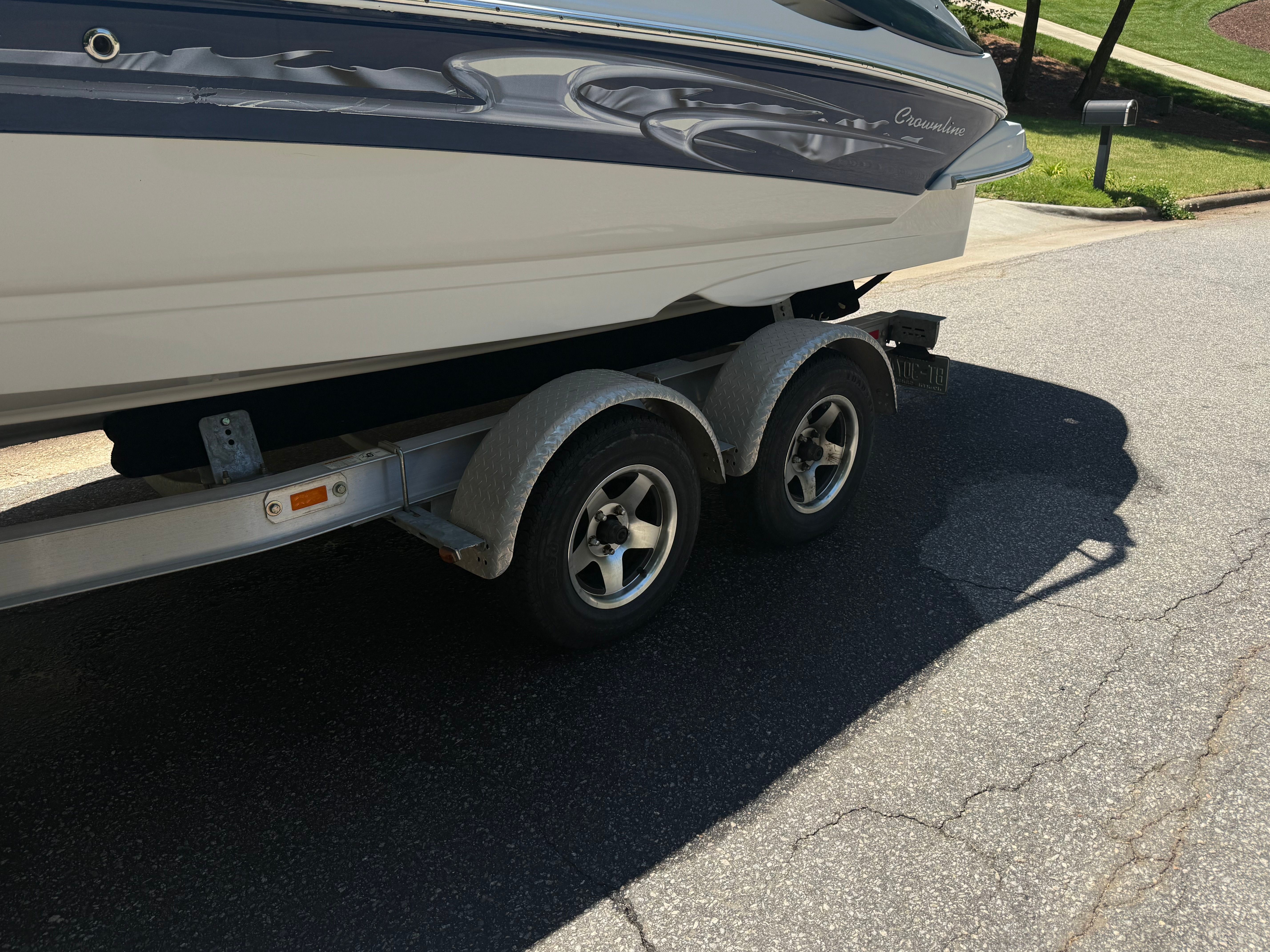 2008 Crownline 210 LX boat on trailer, side view.