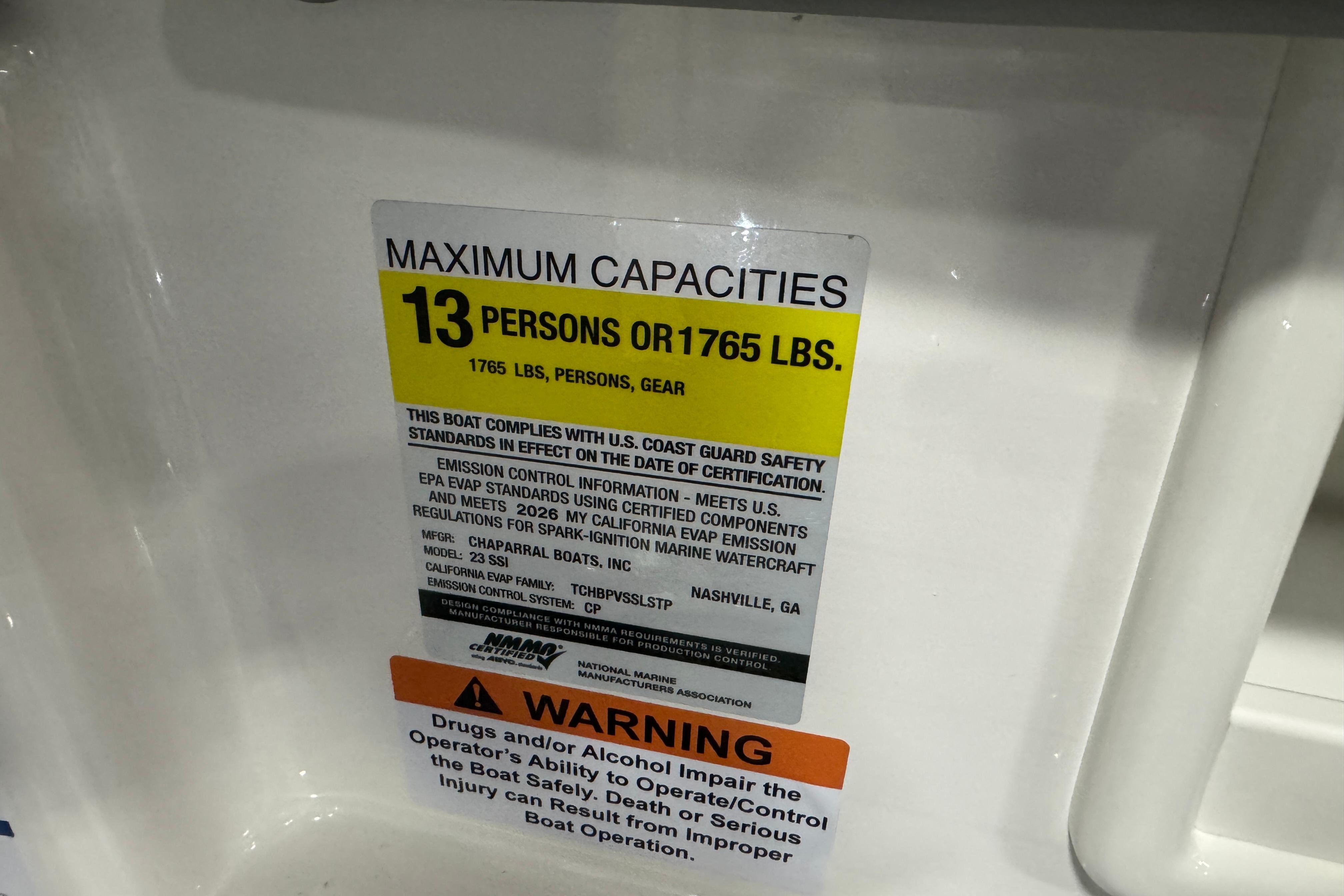 2026 Chaparral 23 SSi capacity label: 13 persons or 1765 lbs, safety compliance.