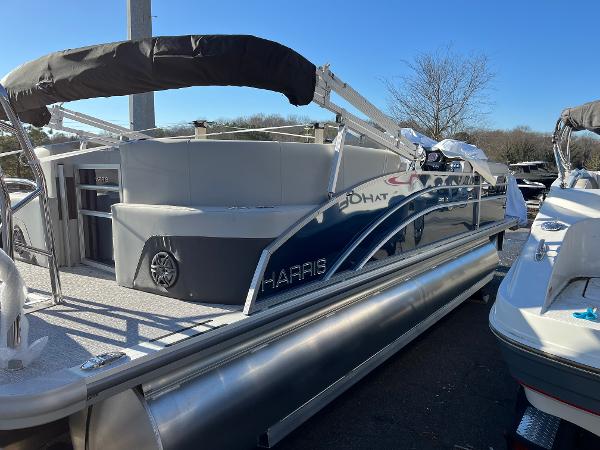 2025 Harris Cruiser 230 pontoon boat with sleek design and spacious deck.