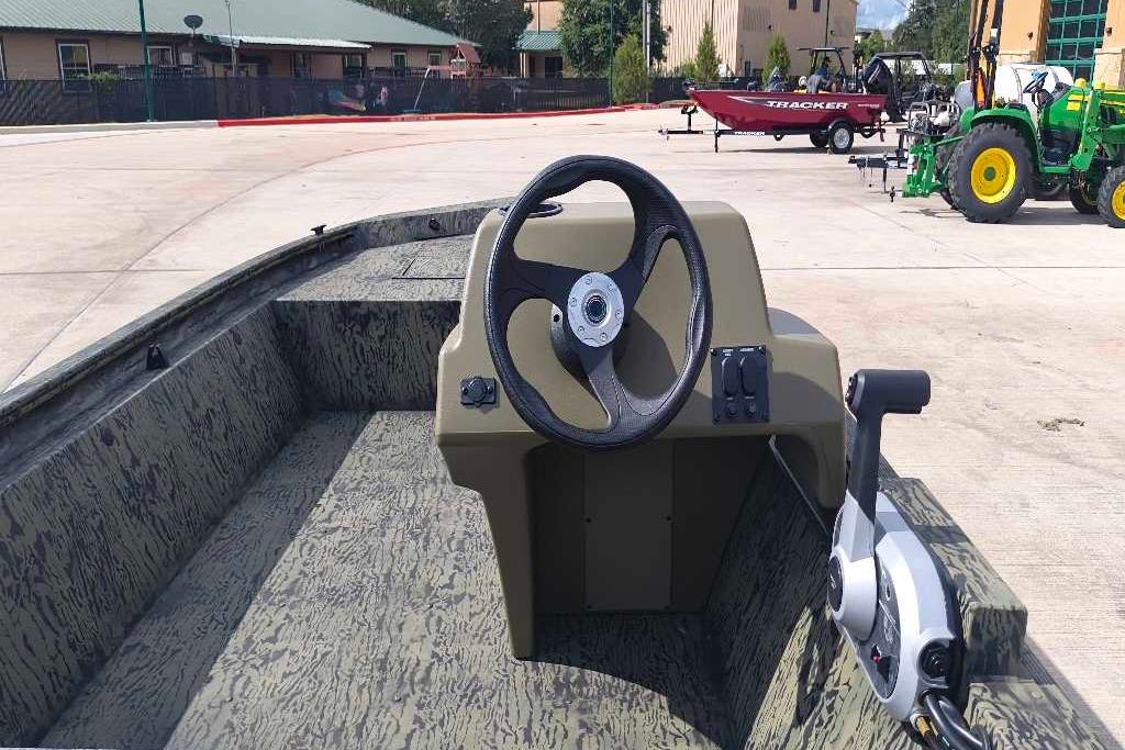 2026 Tracker Grizzly 1648 SC boat interior with steering wheel and control panel.