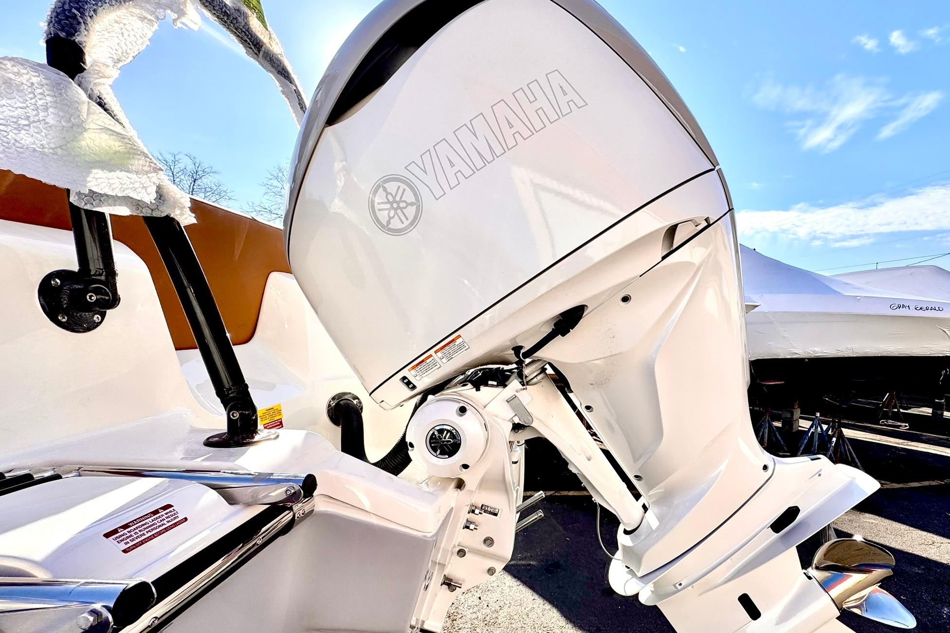 2026 Key West 239 FSR boat with Yamaha outboard motor in sunny setting.