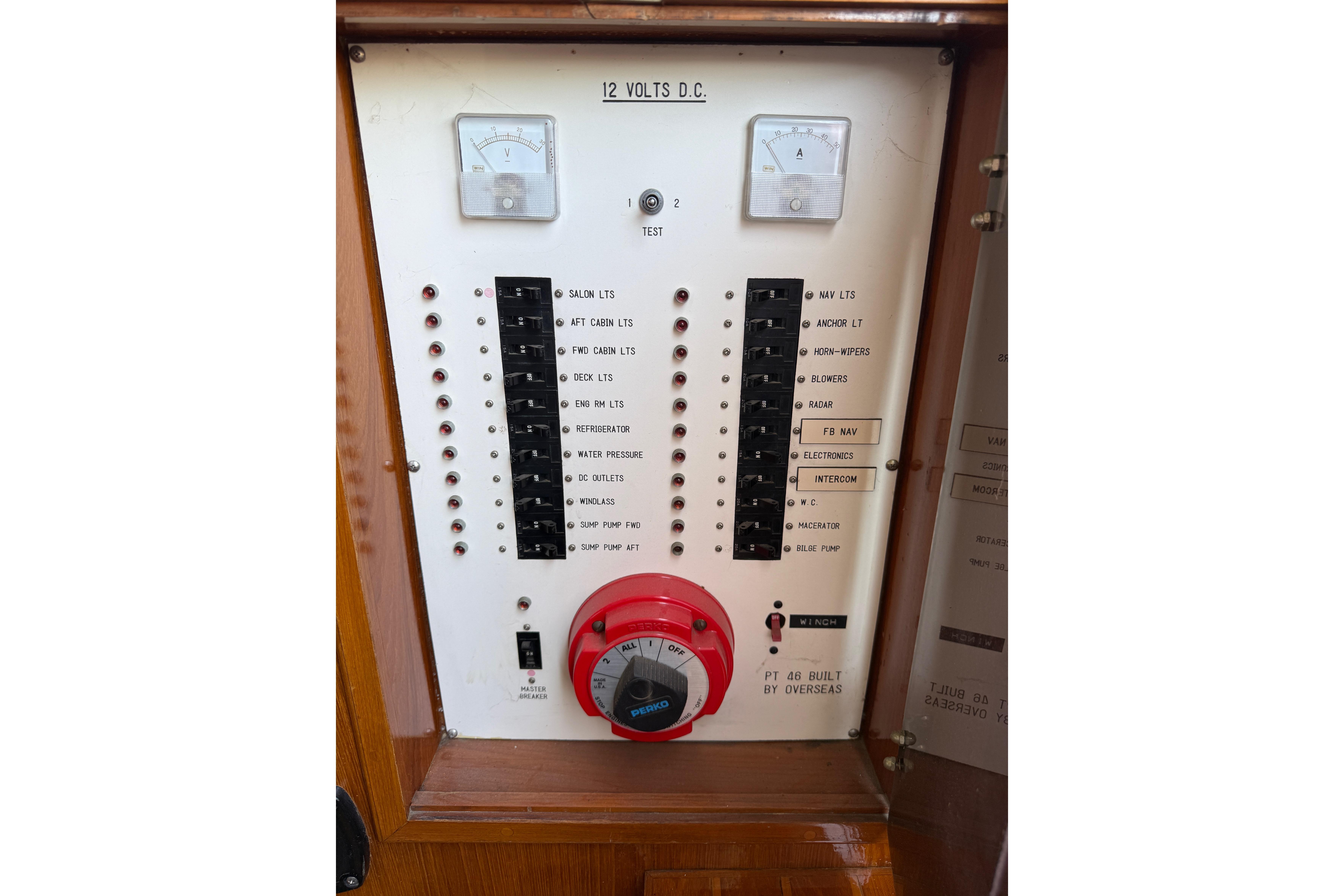 Electrical control panel of a 1987 PT Sundeck boat, featuring switches and gauges.