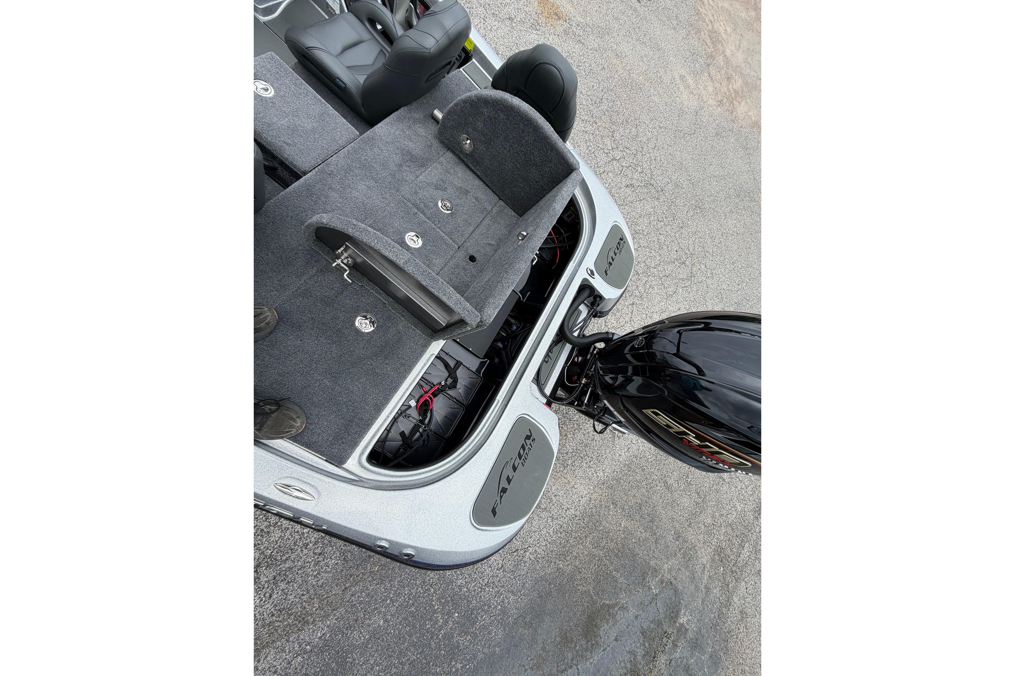 2027 Falcon F20 PREDATOR boat with open storage compartments and powerful outboard motor.