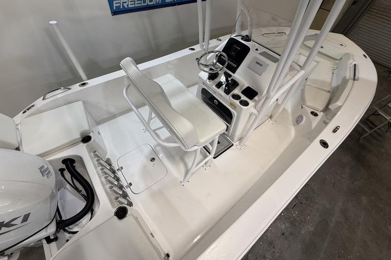 2026 Sea Pro 202 Center Console boat interior with steering wheel and seating.