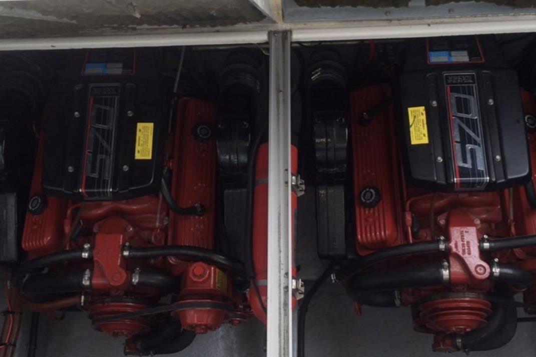 Twin engines of a 1992 Chaparral Signature 30 boat, showcasing detailed mechanical components.