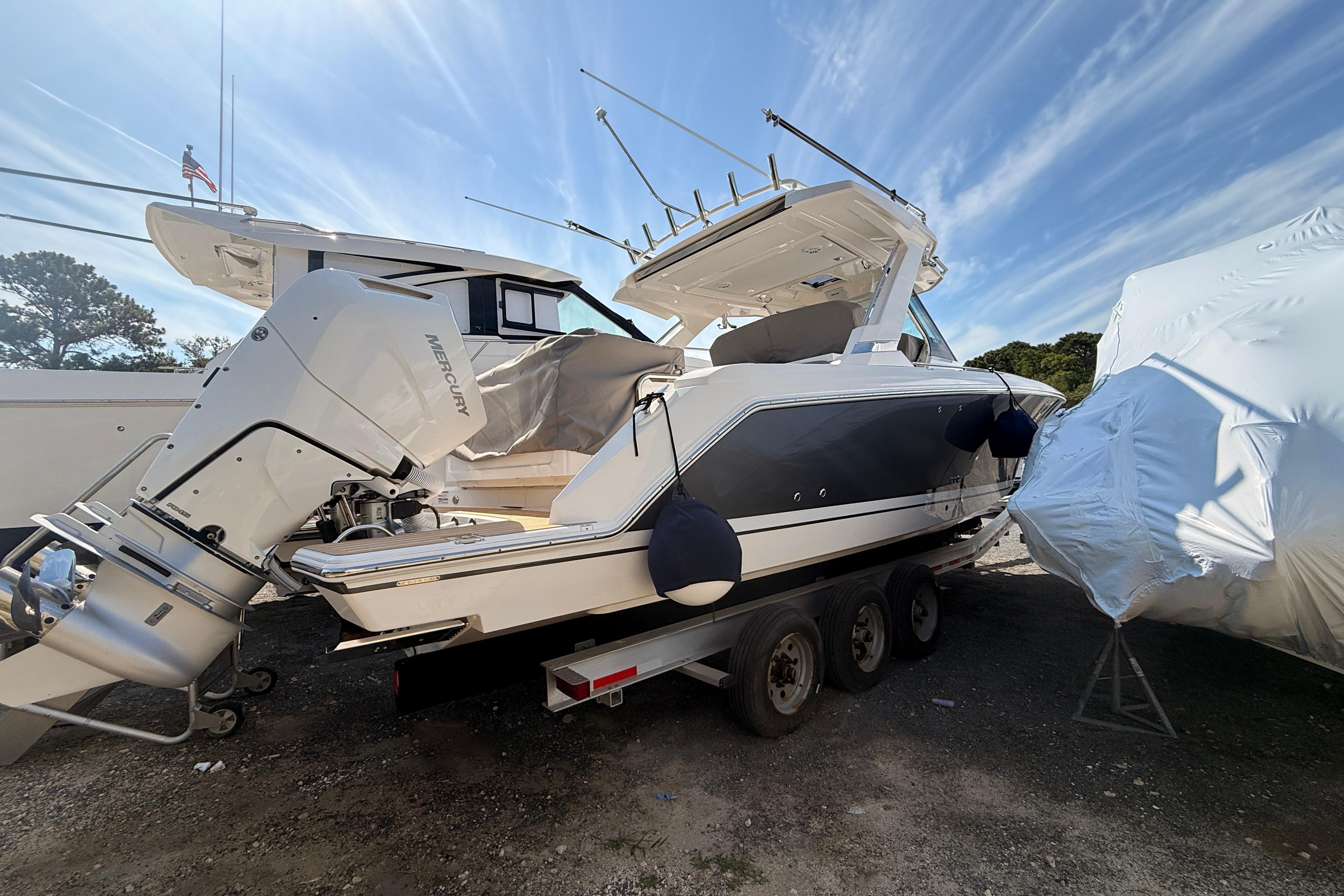 2024 Tiara Yachts 34 LS boat on trailer, featuring Mercury outboard engines.