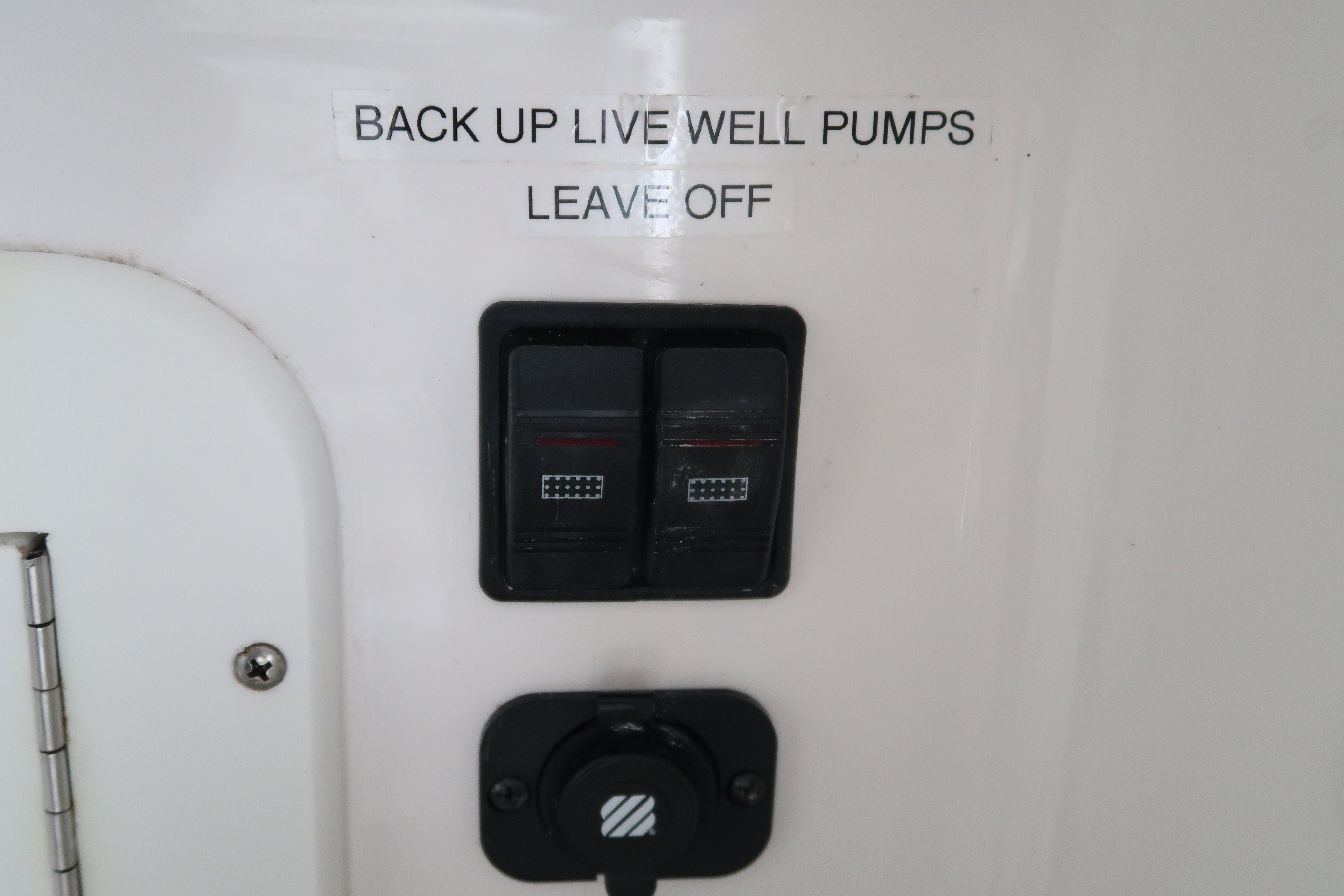 Control panel for backup live well pumps on a 2016 Invincible 42 Open Fisherman.