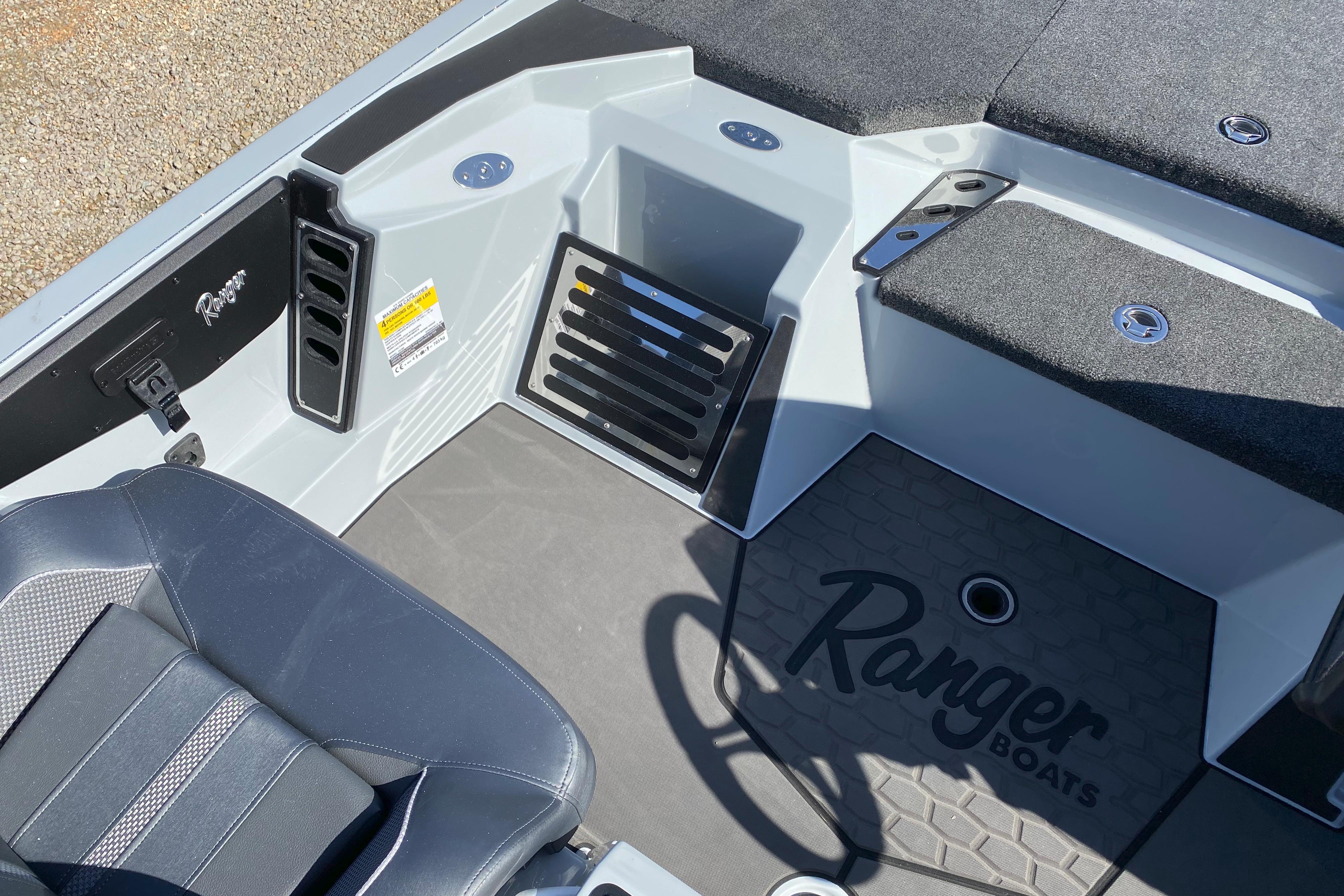 Interior of 2026 Ranger Z519R boat, featuring seating and storage compartments.