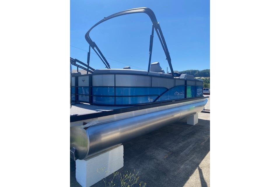 2026 Manitou 23 AURORA RF VPII 575 pontoon boat displayed outdoors.