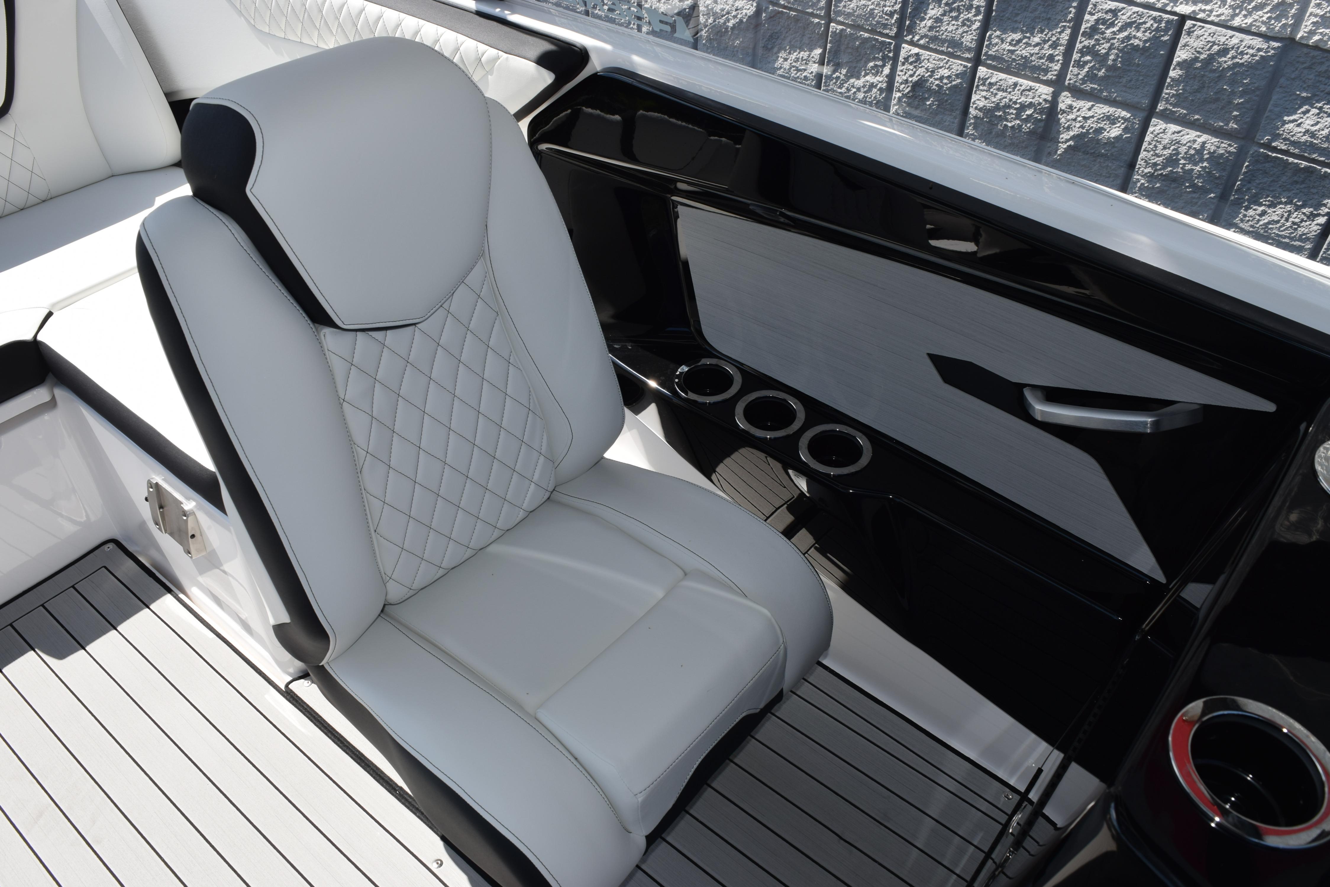 2026 Yamaha Boats 222SE interior with luxurious white seating and sleek black accents.