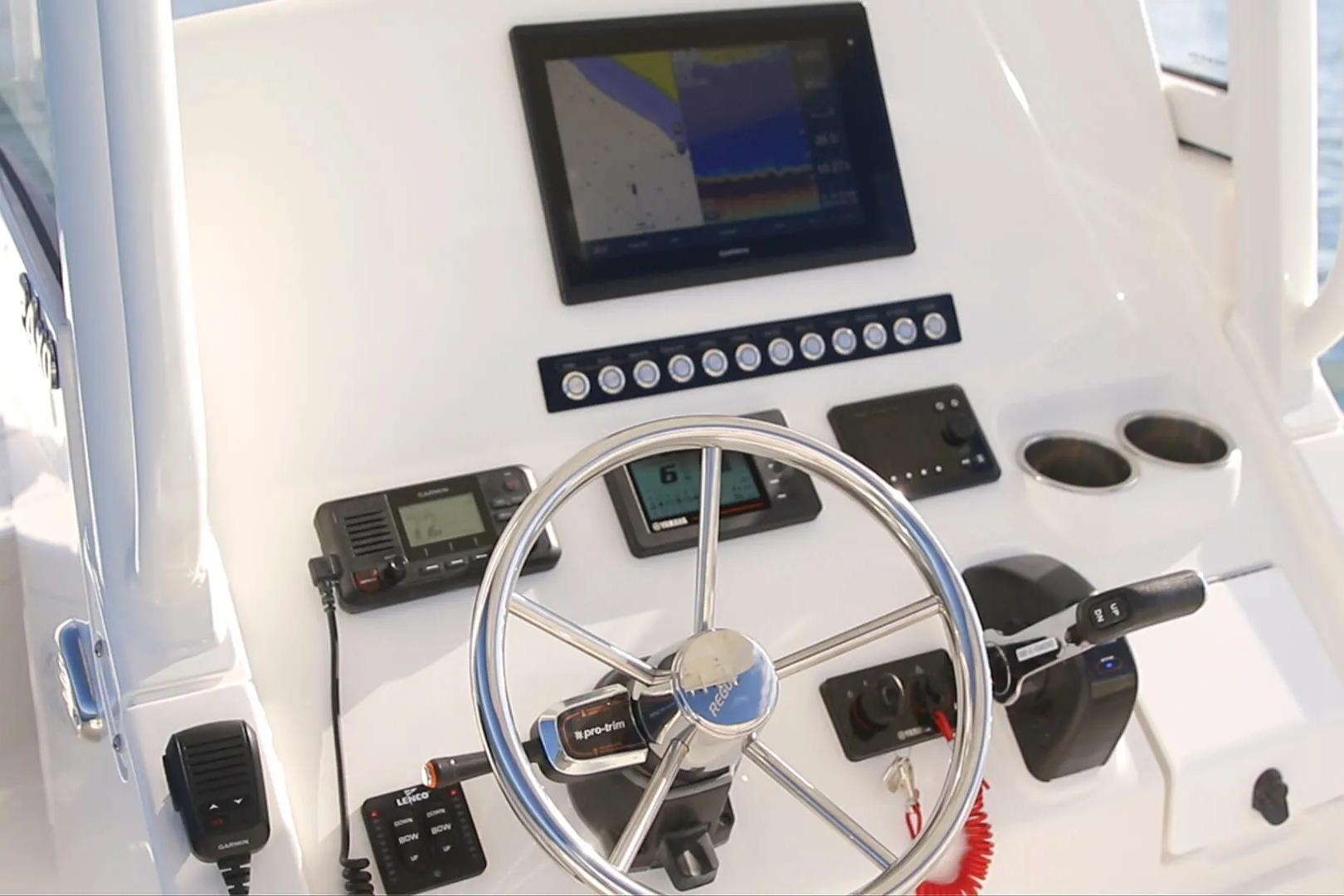 Helm of 2027 Regulator 24XO boat with modern navigation equipment and controls.