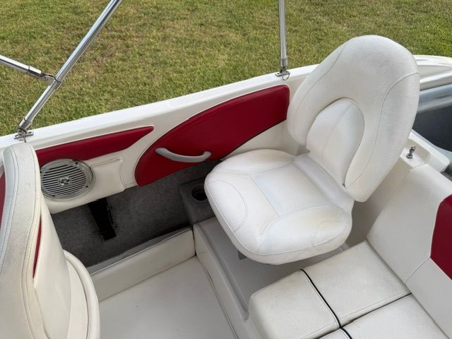 Interior of a 2012 Bayliner 184 SF boat with white seating.