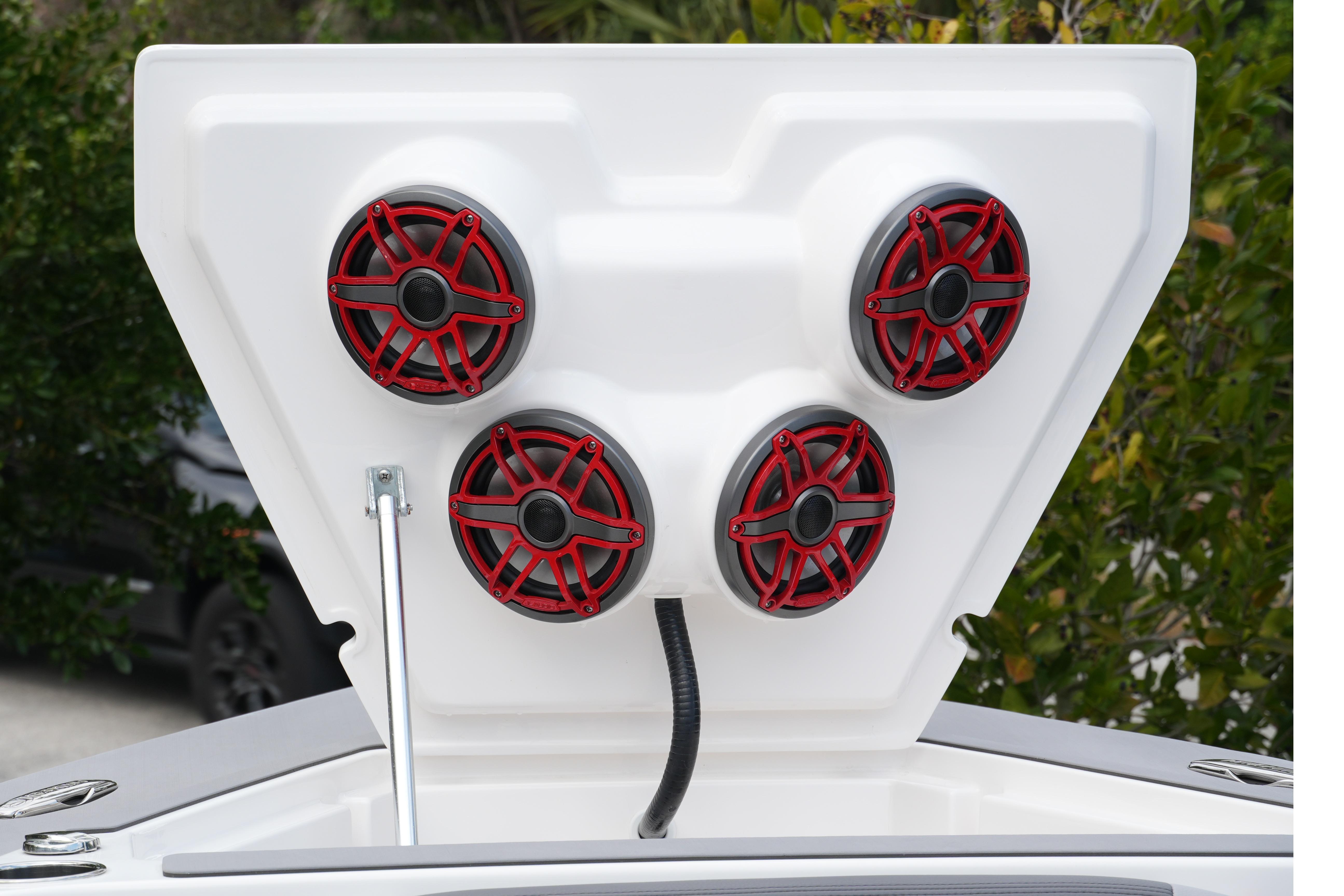 2025 Fountain 38 SCX boat with four red marine speakers on a white panel.