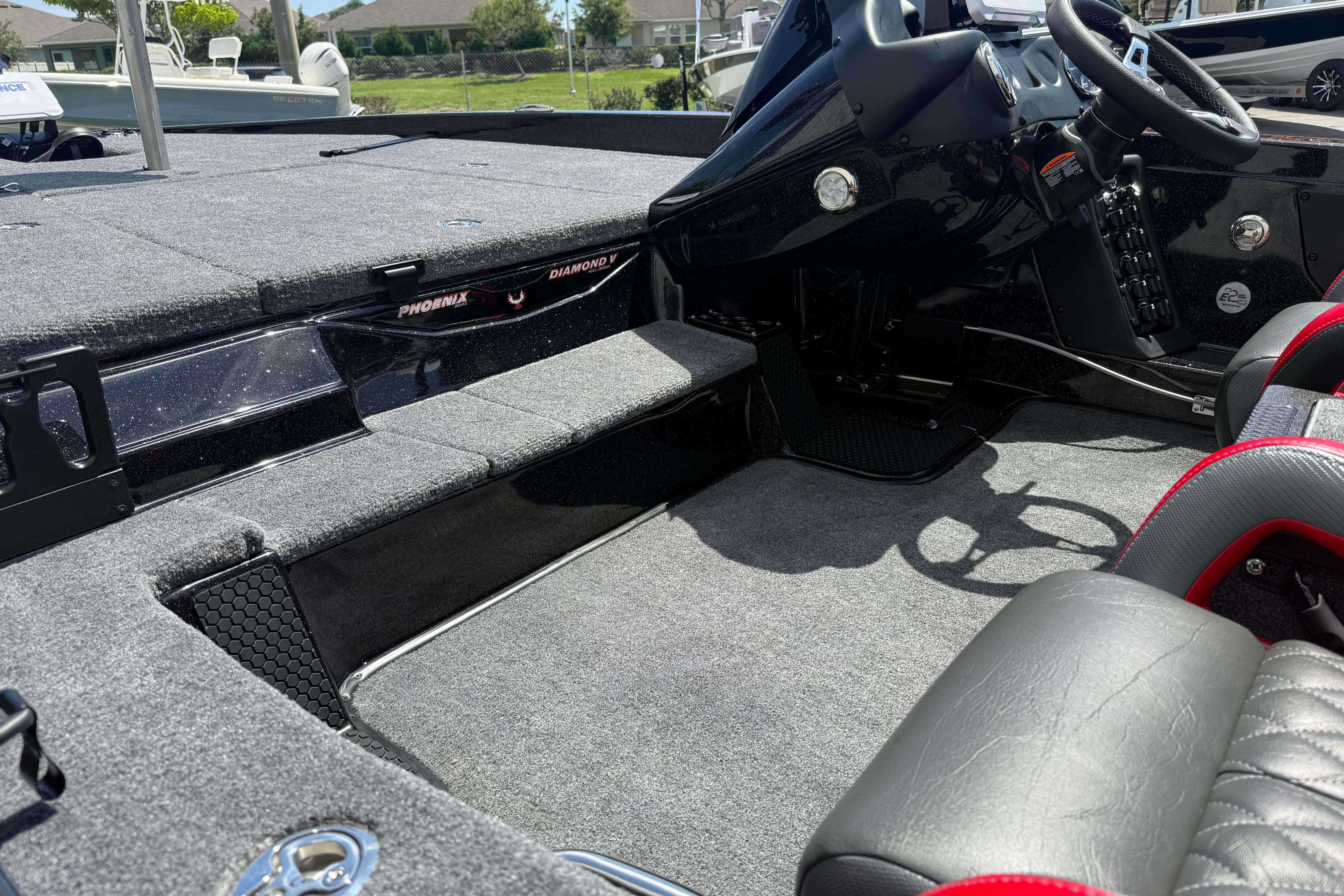 Interior of 2027 Phoenix 919 ZXL boat, featuring sleek design and modern controls.