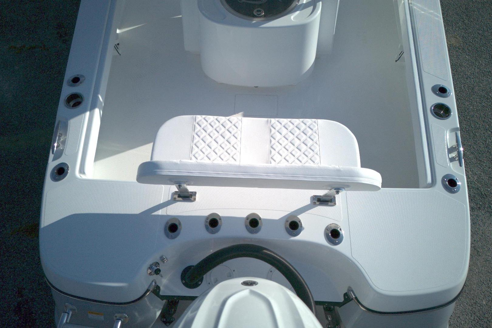 2026 BlackJack 256 Coastal boat interior with white seating and rod holders.