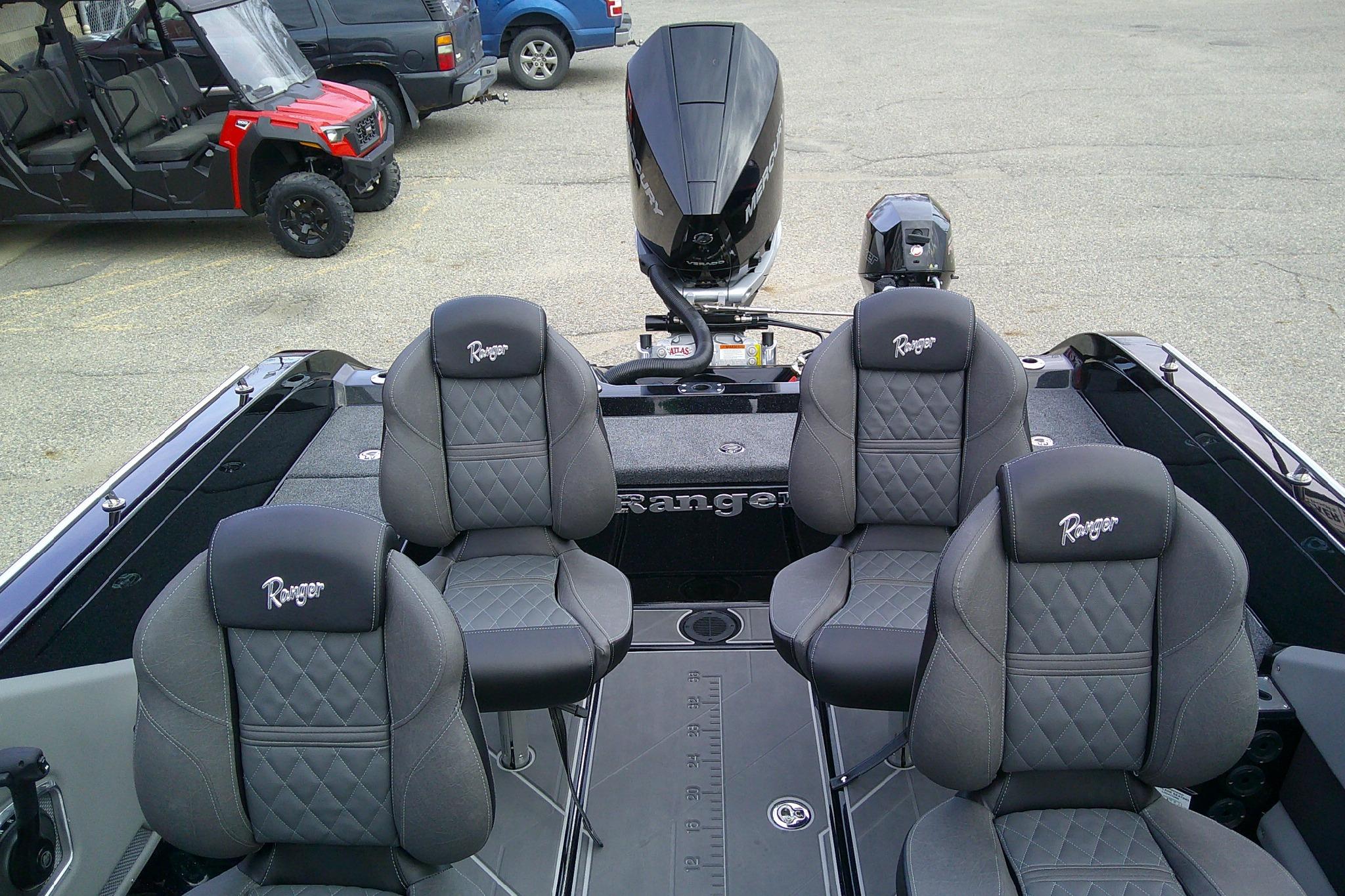 2026 Ranger 620FS Pro boat interior with four cushioned seats and motor.