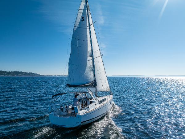 2021 Beneteau Oceanis 38.1 sailboat cruising on open water.