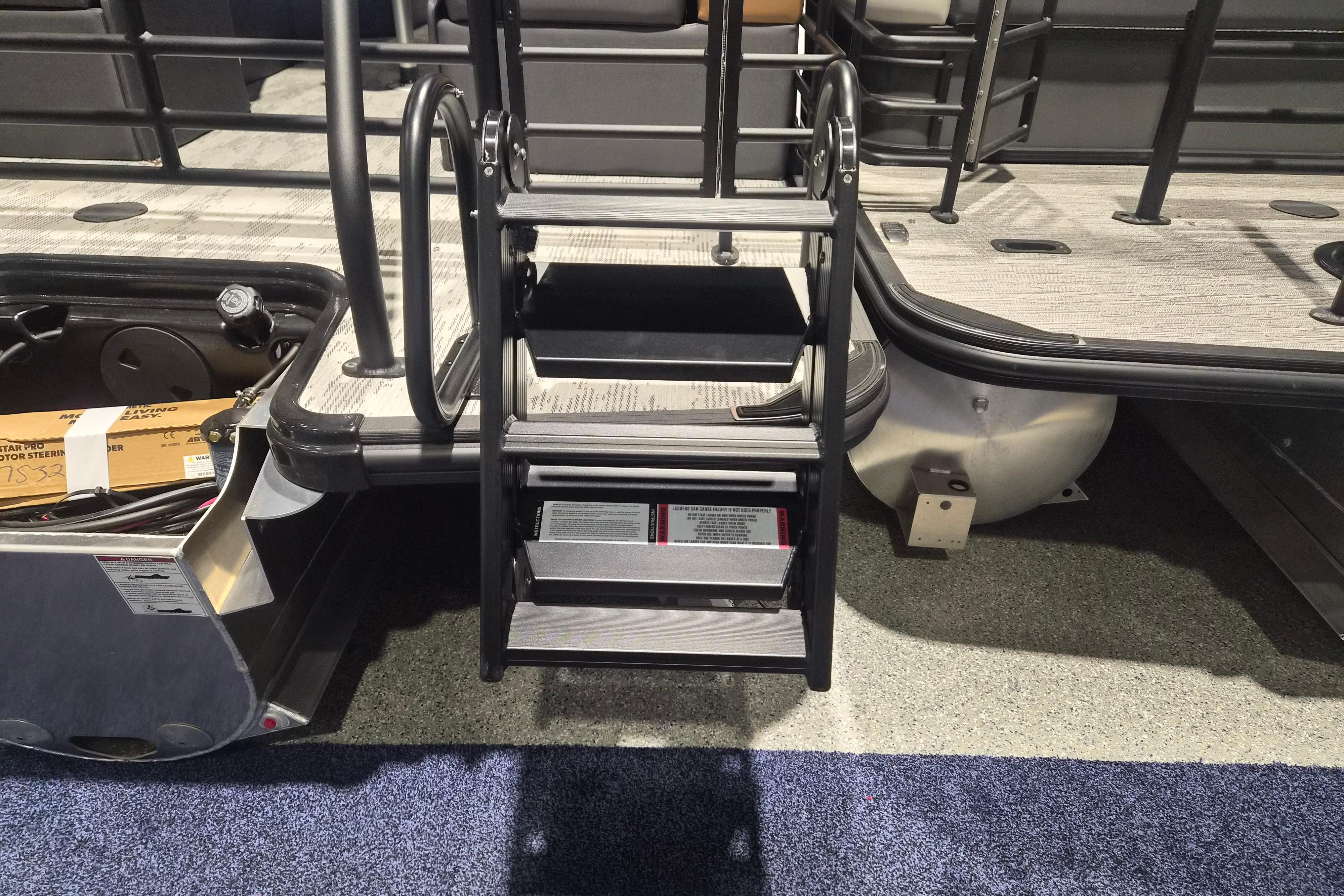 2026 Sylvan L3 SLZ pontoon boat with boarding ladder and storage compartment.