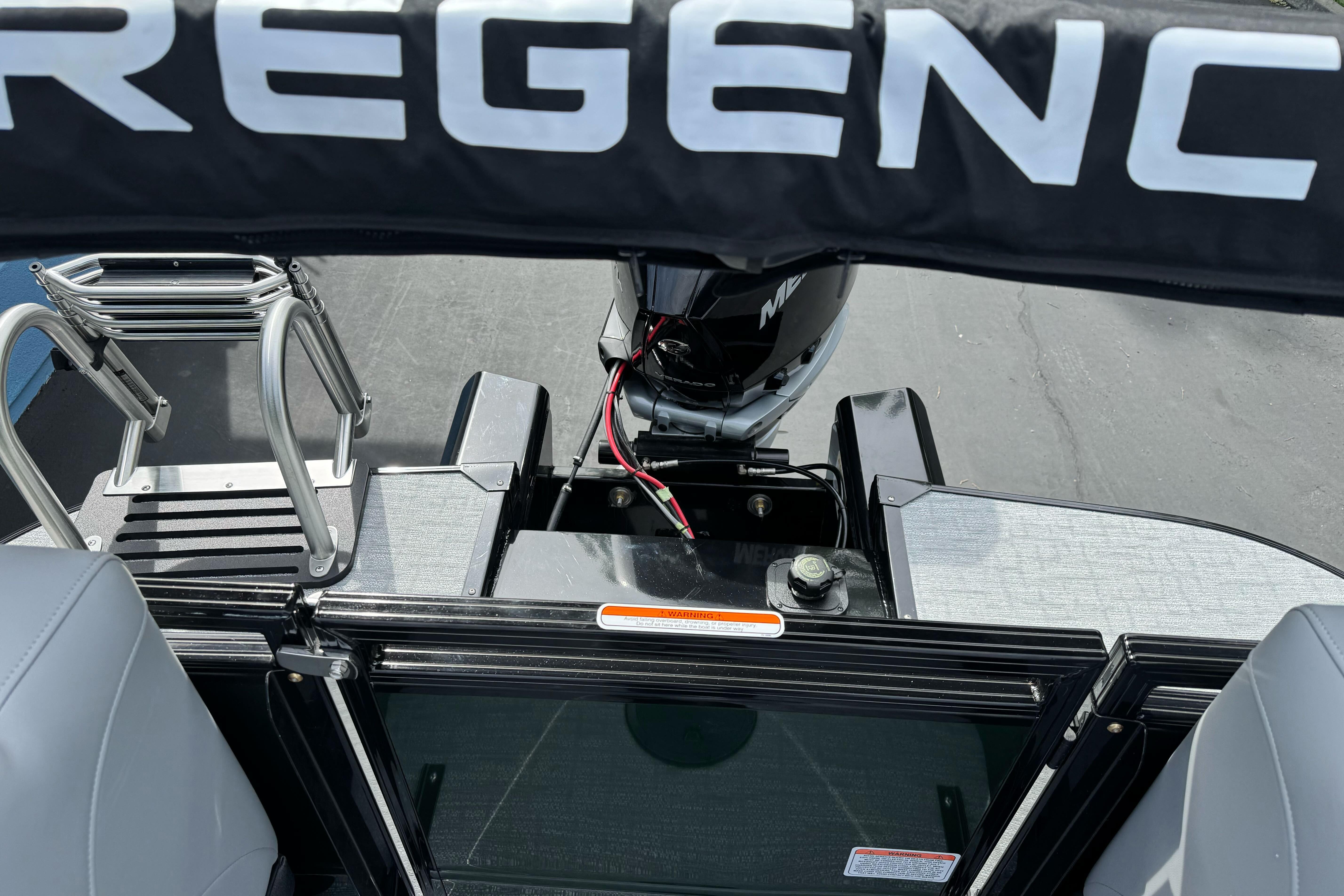 2026 Regency 250 DL boat stern view with motor and ladder.