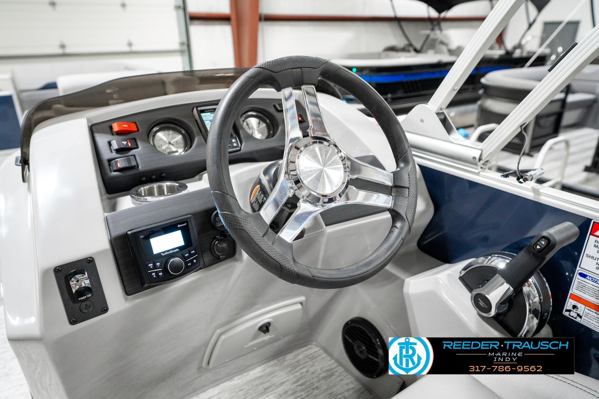 2025 Bennington 23 S Cruise boat dashboard with steering wheel and control panel.