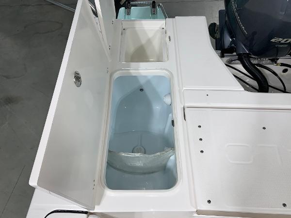 2026 Robalo 226 Cayman boat storage compartments and engine view.