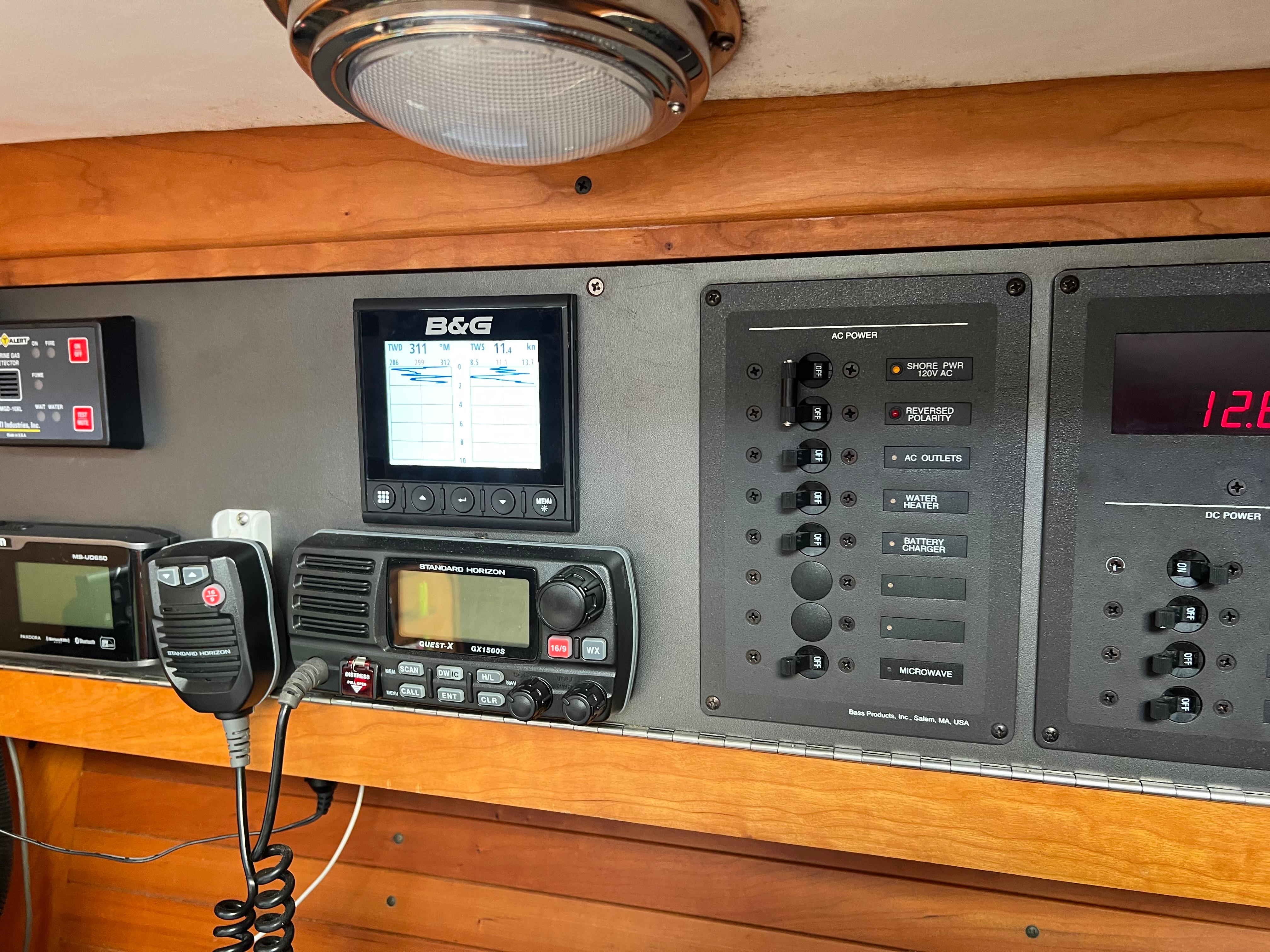 Control panel of a 2001 J Boats J/120 yacht with navigation and communication equipment.