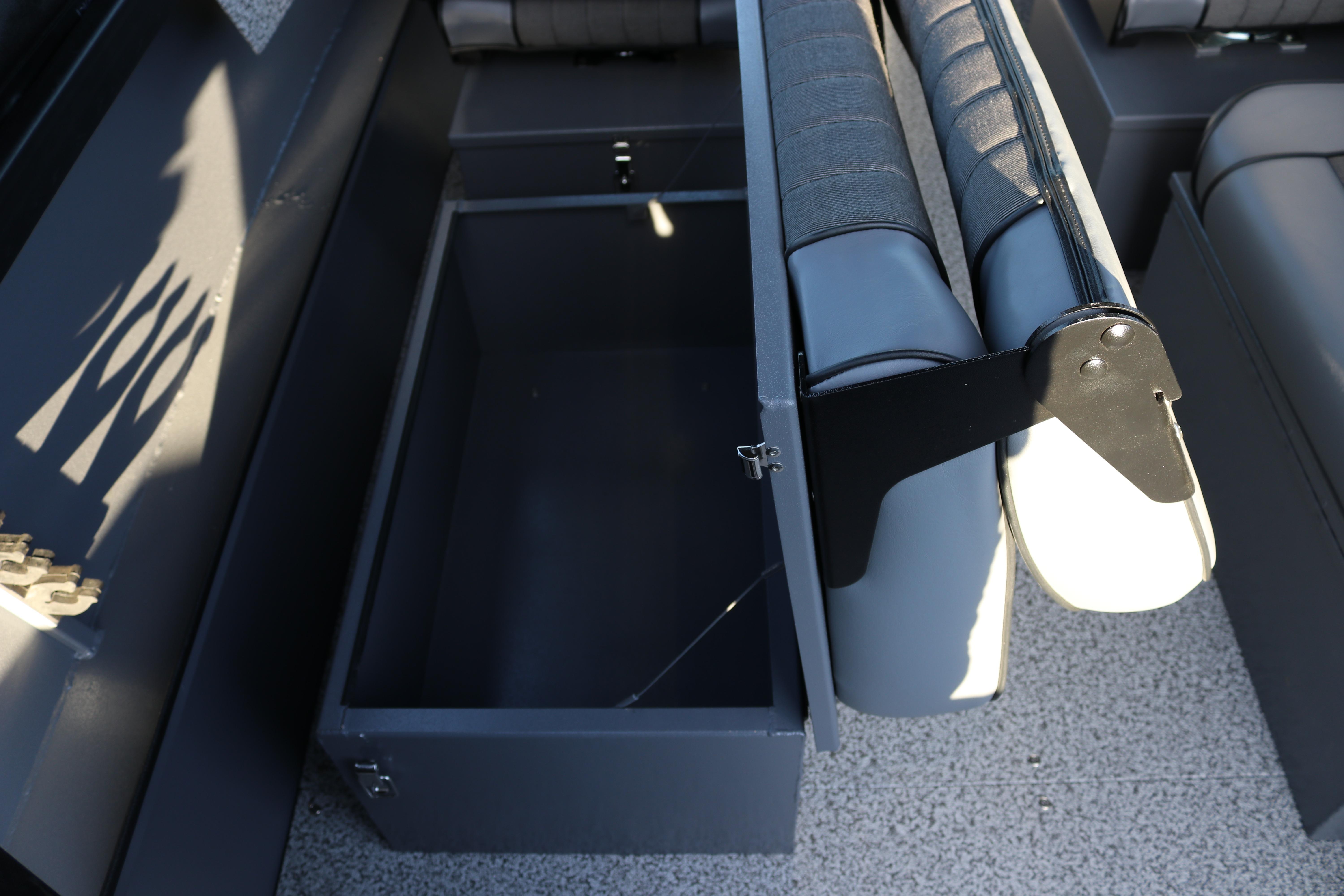 Open storage compartment in 2026 Alumaweld Stryker X202 boat, featuring cushioned seating.