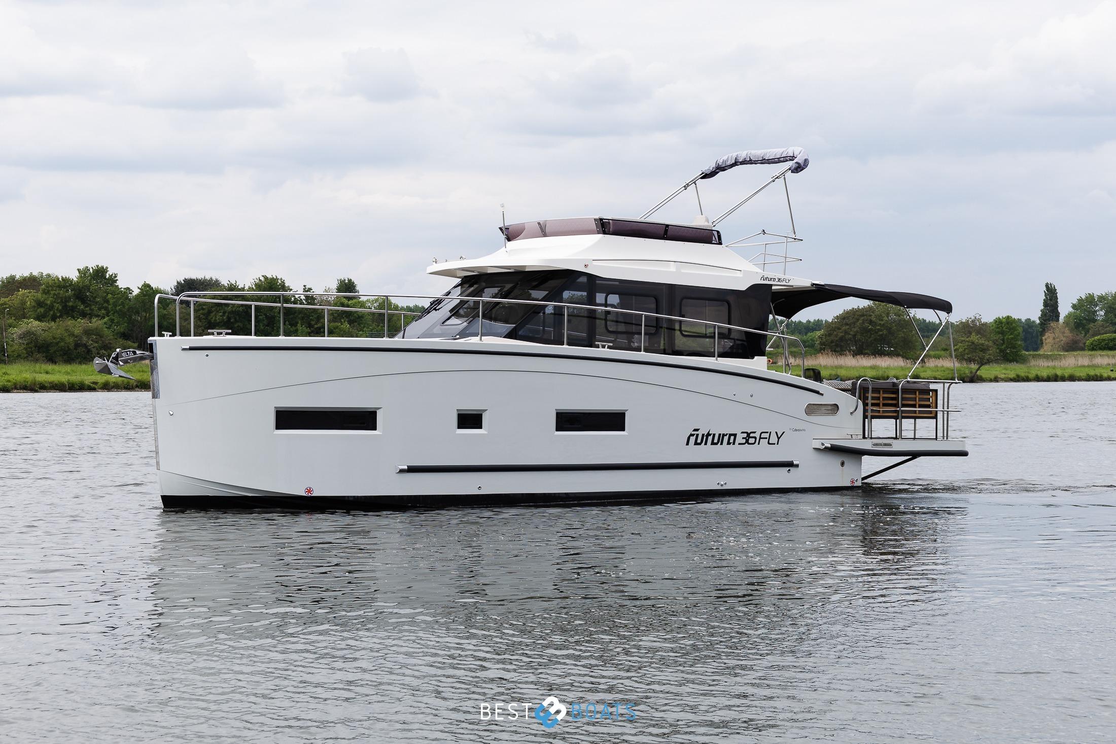 2023 Cobra Yachts Futura 36 Premium Fly cruising on a calm river.