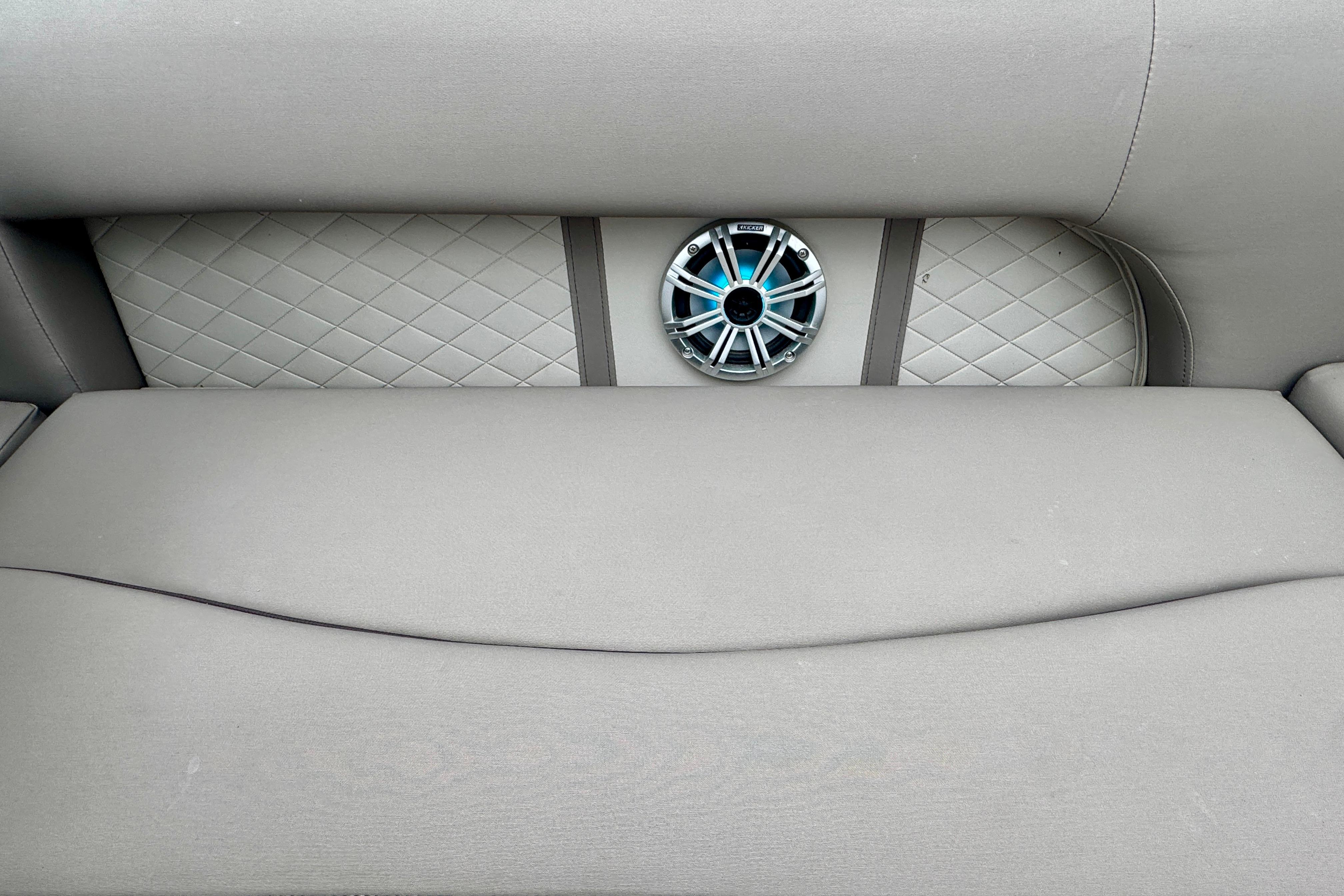 2019 Bennington SX 22 SSBXP boat seat with diamond-patterned upholstery and speaker.