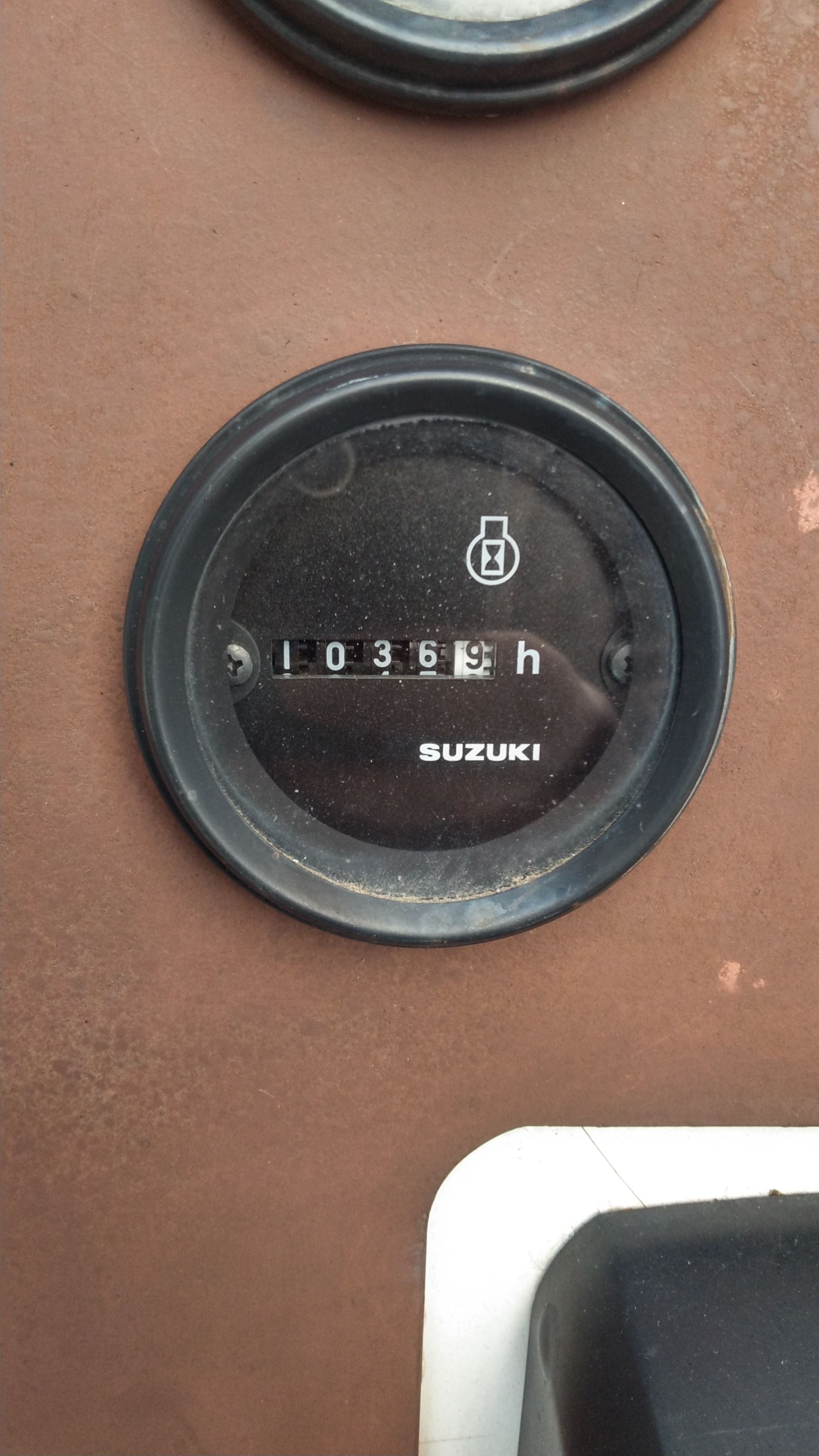 Close-up of a Suzuki hour meter showing 369 hours.