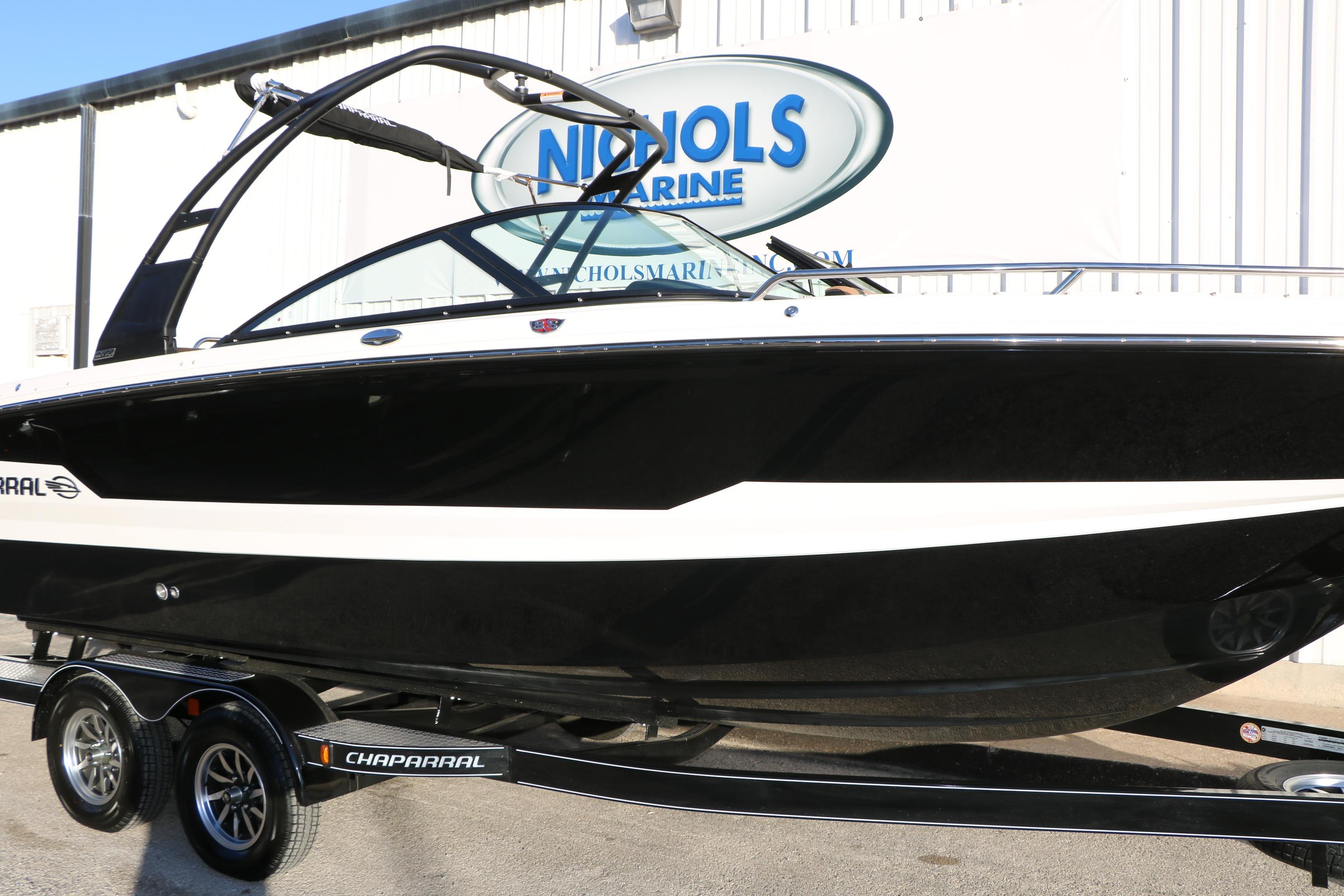 2026 Chaparral 247 SSX boat on trailer at Nichols Marine dealership.