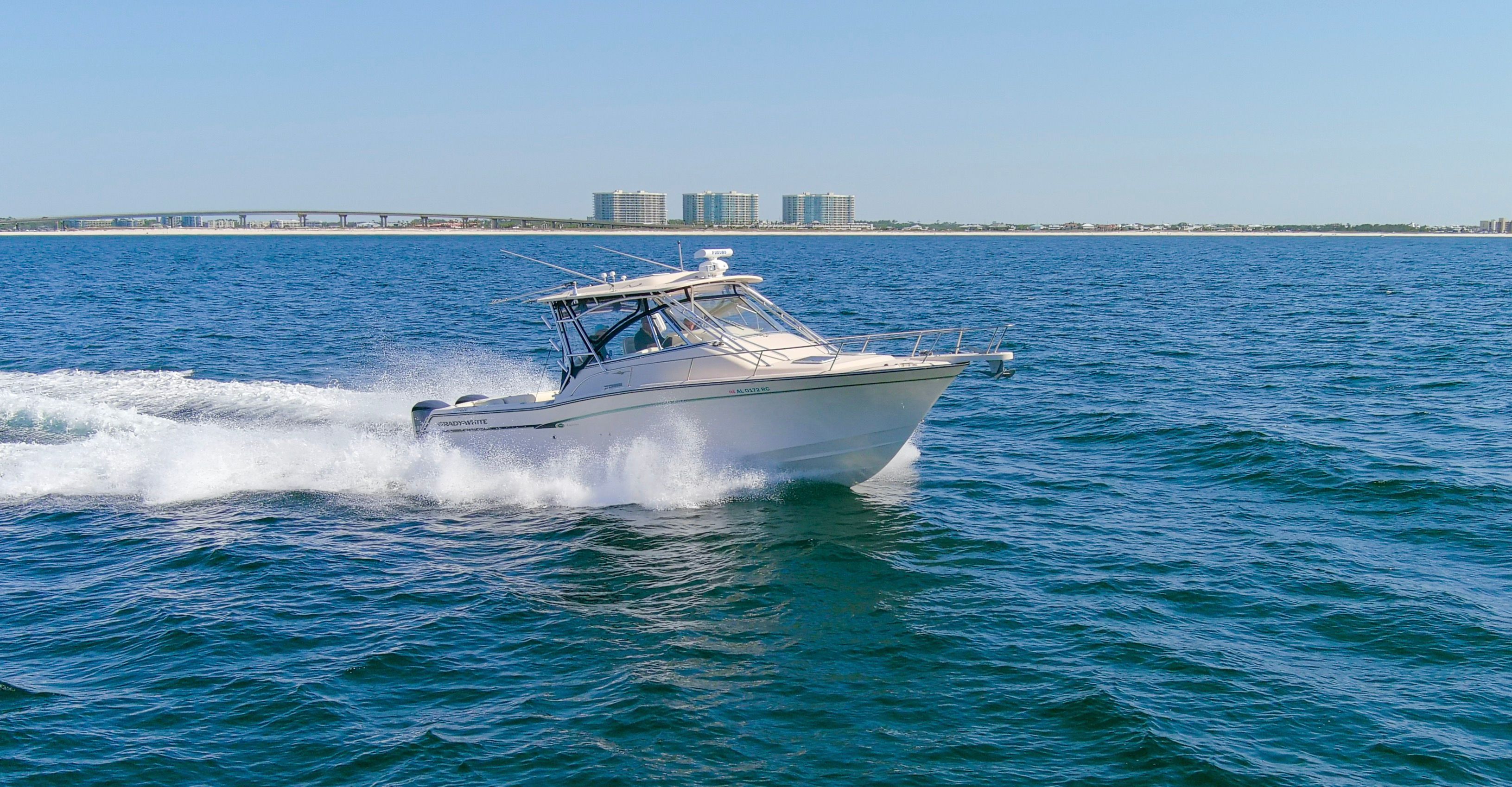 2009 Grady-White Express 330 boat cruising on water.