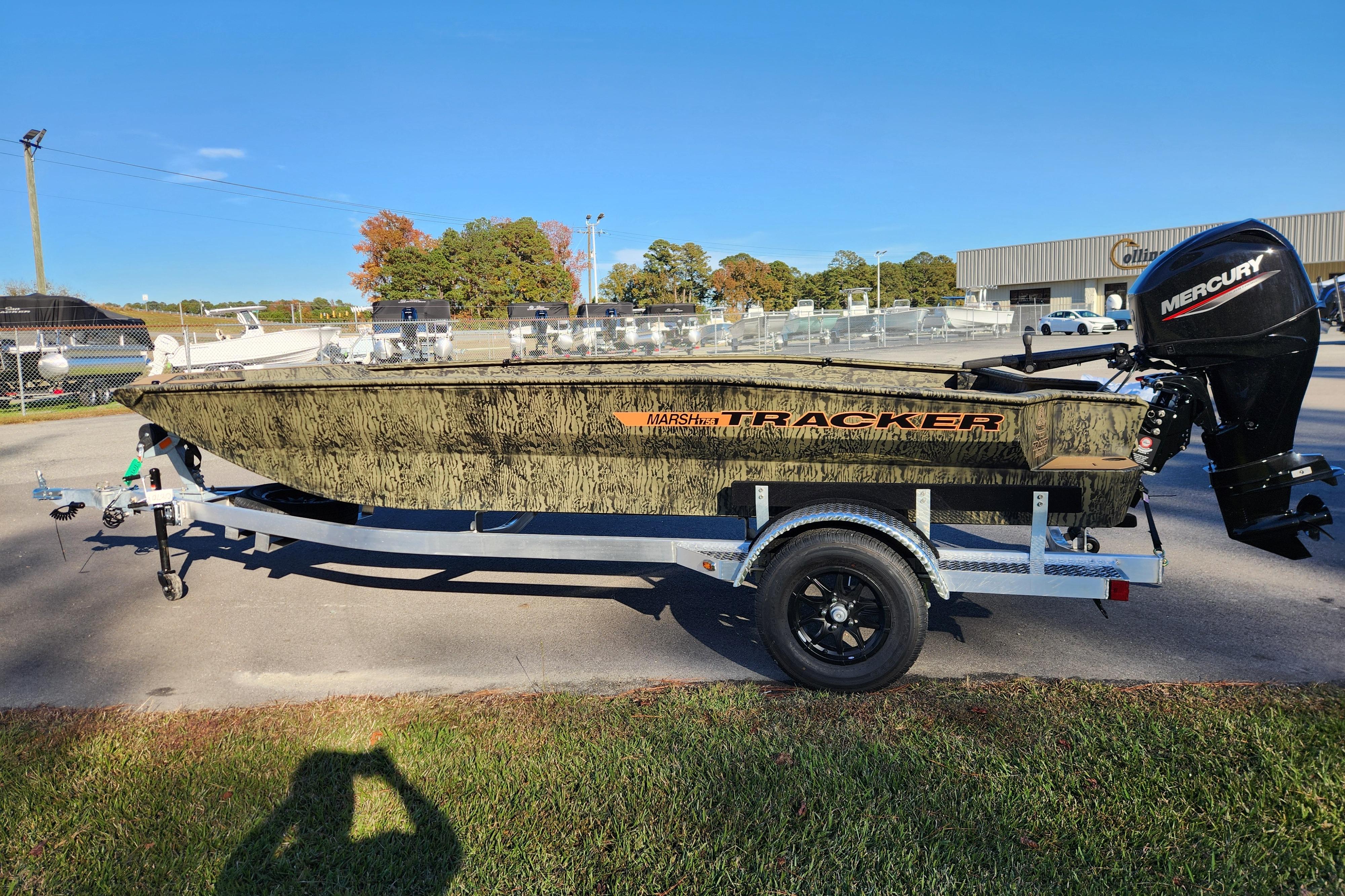 2026 Tracker Grizzly 1756 T Marsh boat on trailer with Mercury outboard motor.