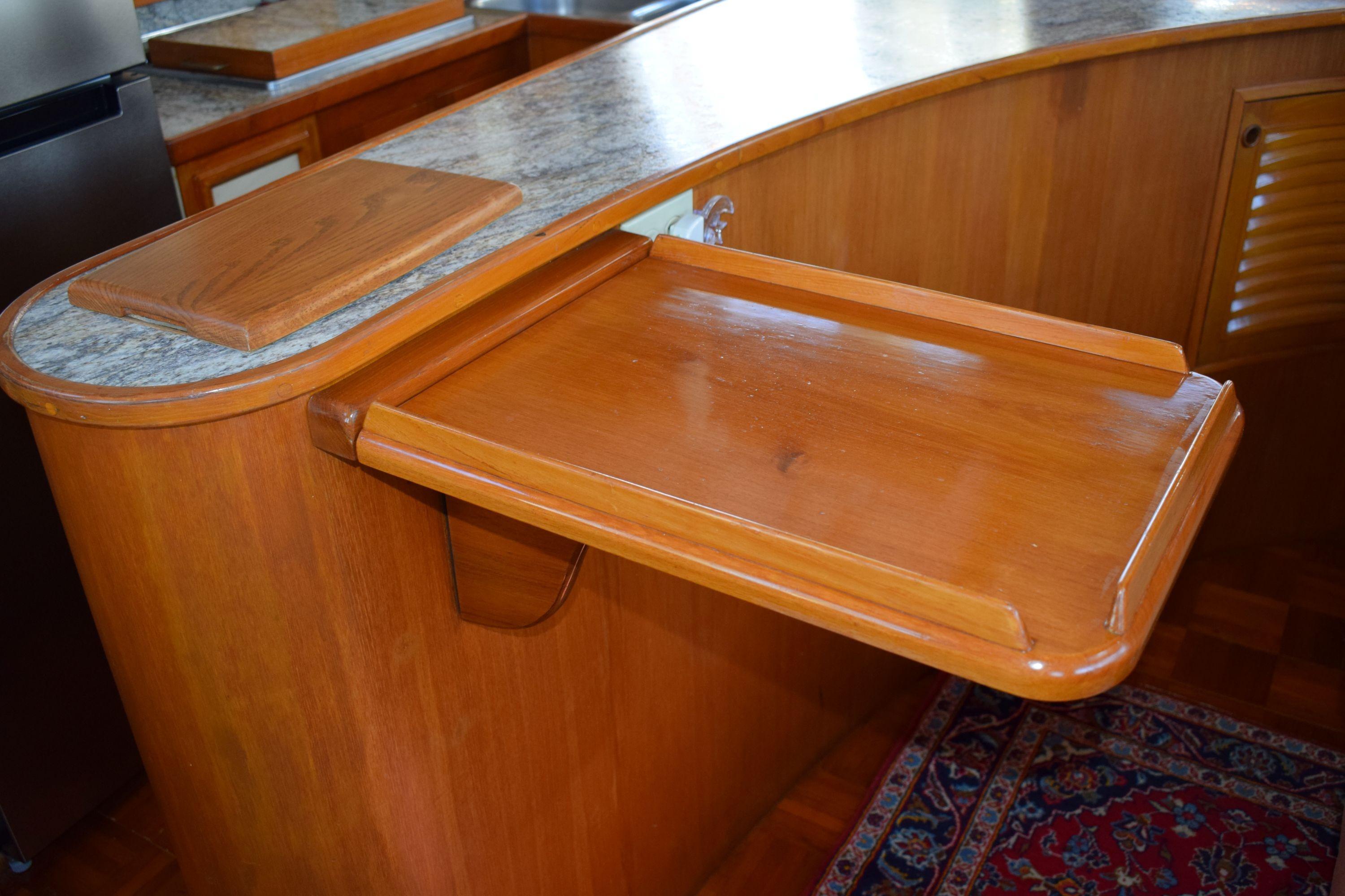 Wooden interior detail of 1980 Cheoy Lee 52 Motorsailer yacht with foldable table.