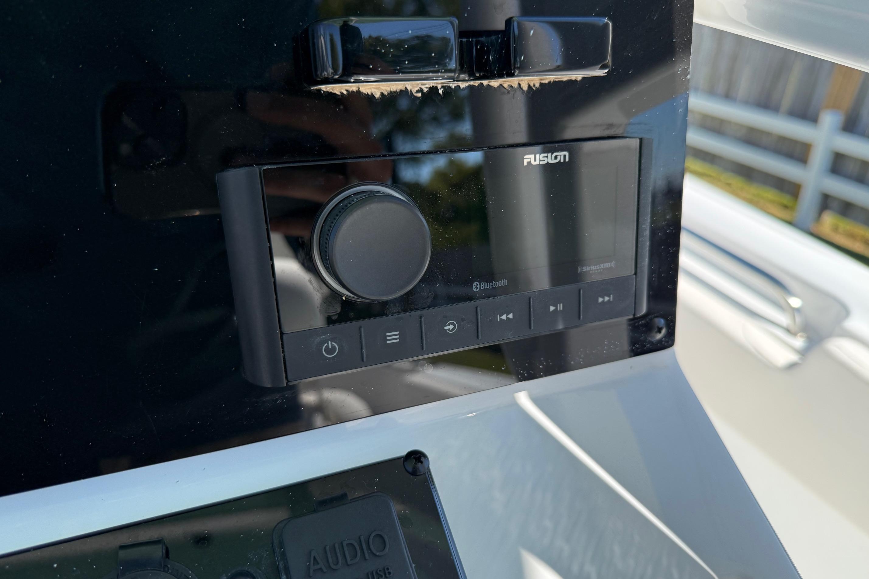 2026 Sea Hunt Ultra 229 boat audio system with Fusion Bluetooth controls.