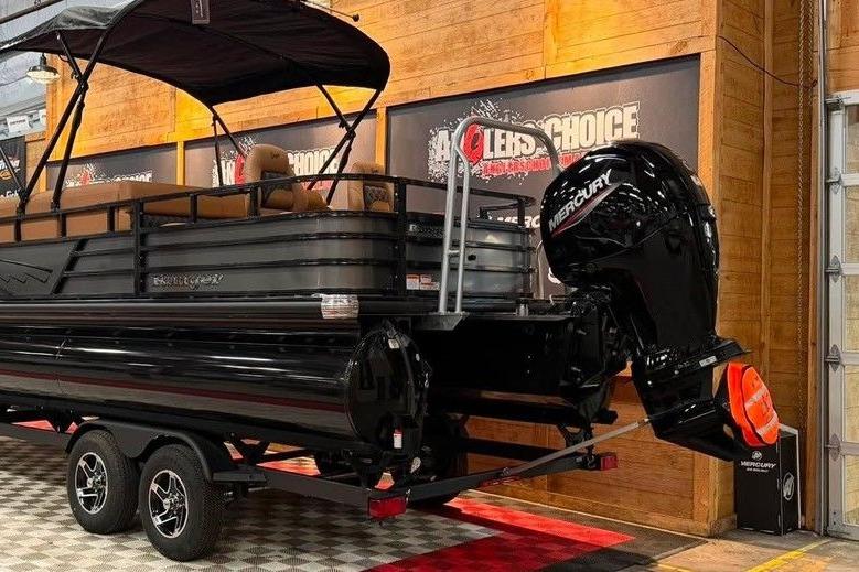2026 Ranger 220F pontoon boat with Mercury engine on display indoors.