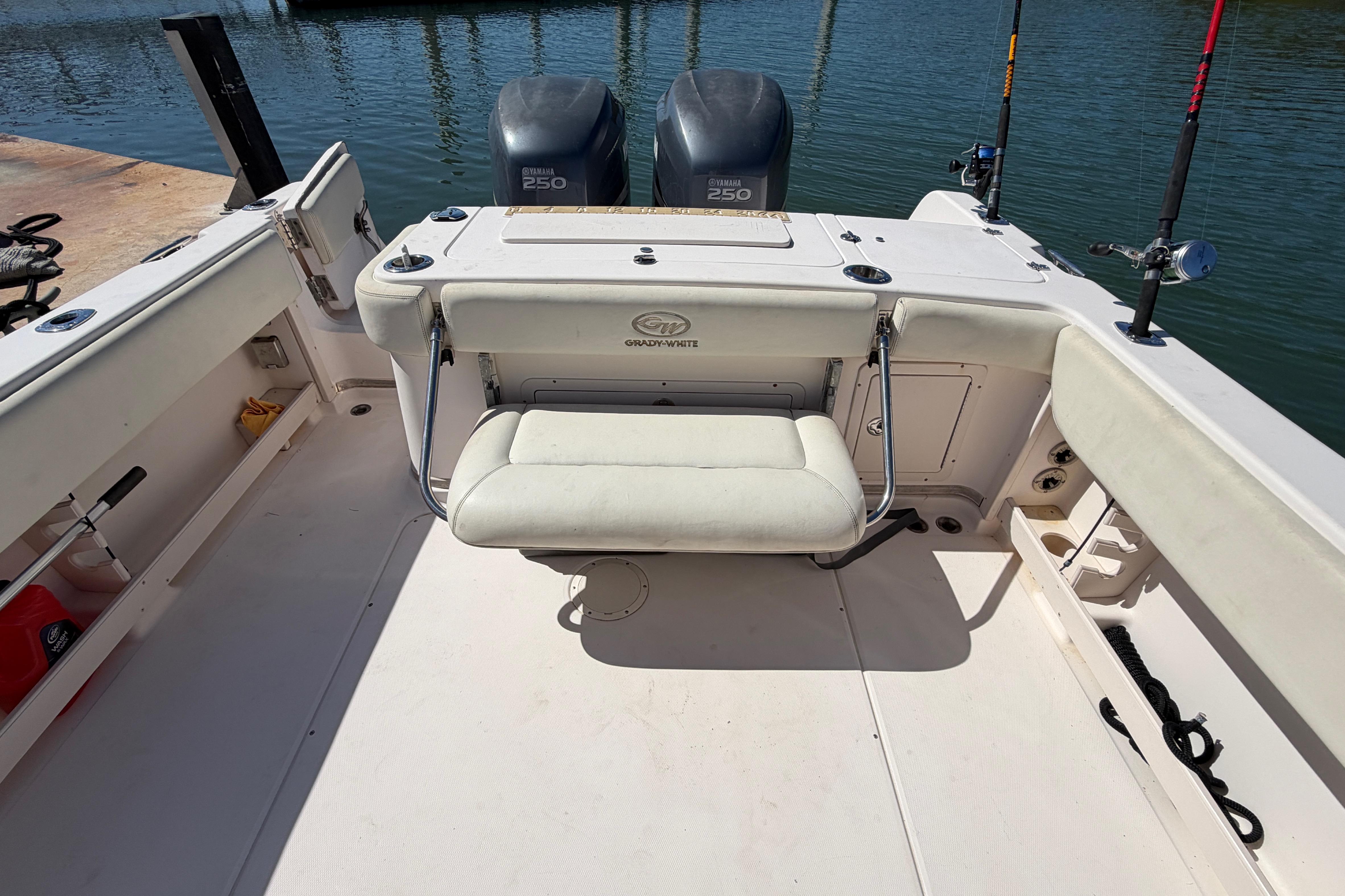 2006 Grady-White Sailfish 282 boat interior with Yamaha 250 engines and fishing rods.