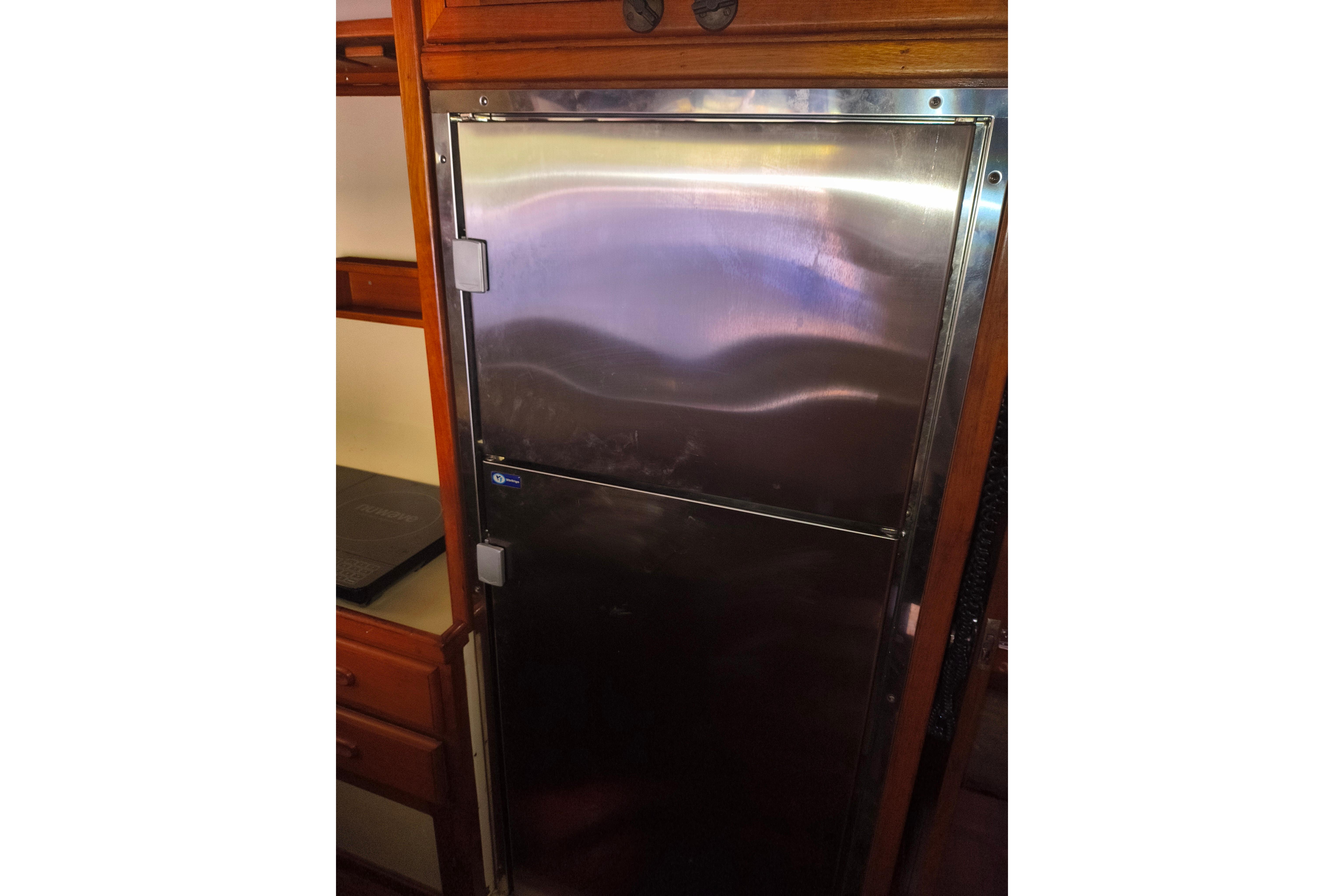 Stainless steel refrigerator in 1984 Kadey-Krogen Manatee yacht interior.
