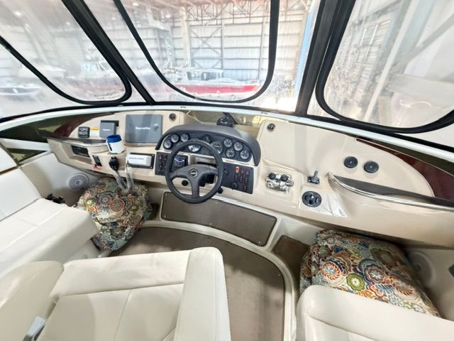 Interior view of the helm station on a 2005 Carver 44 Cockpit Motor Yacht.