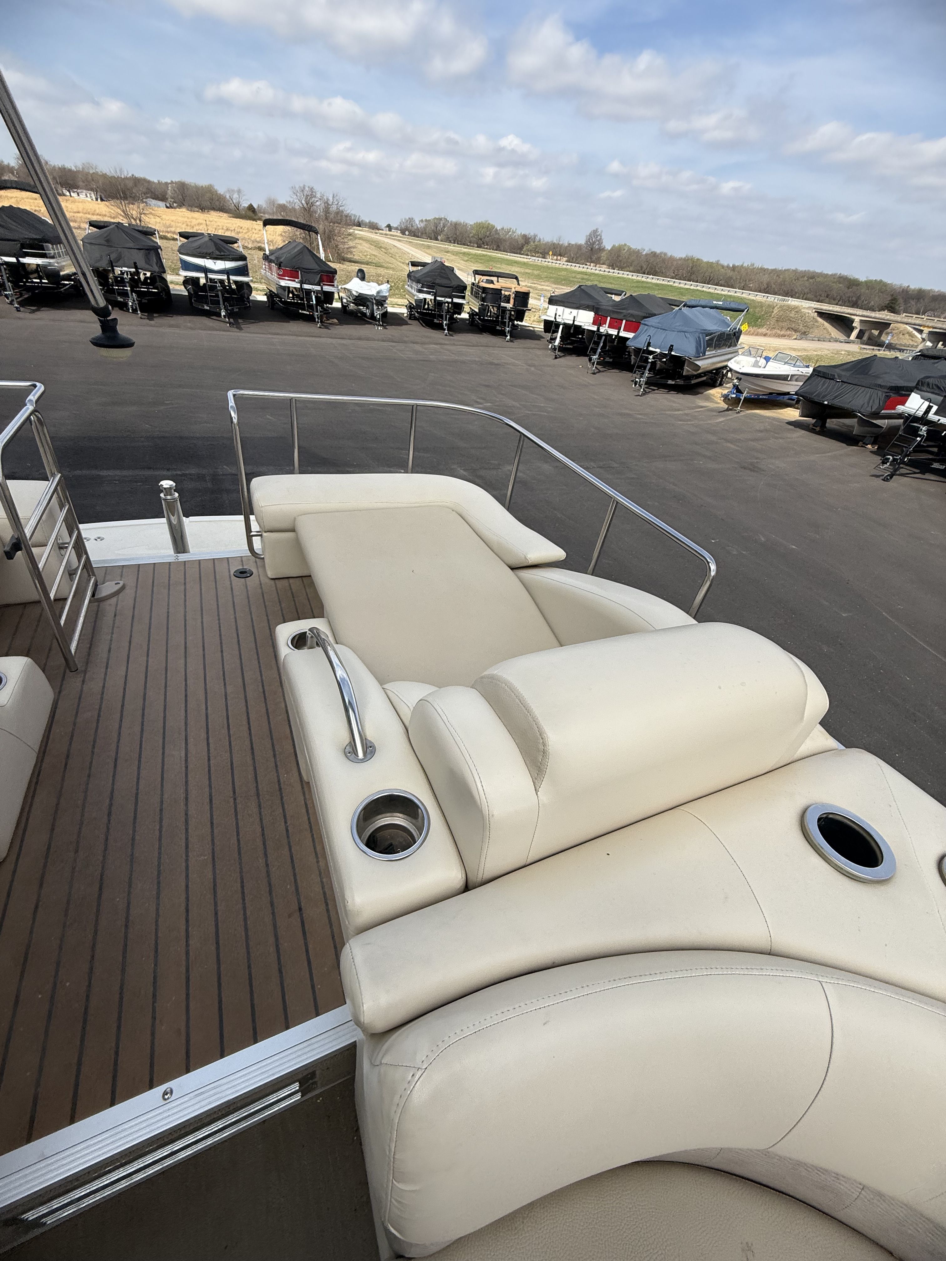 2014 Bennington 2575RCW-I/O pontoon boat with outdoor lounge seating.