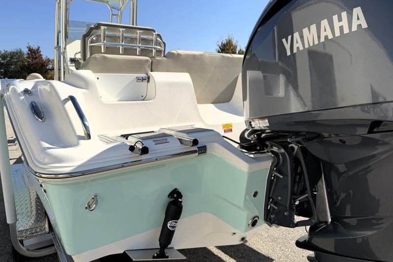 2025 Key West 239 FS boat with Yamaha outboard motor, rear view.