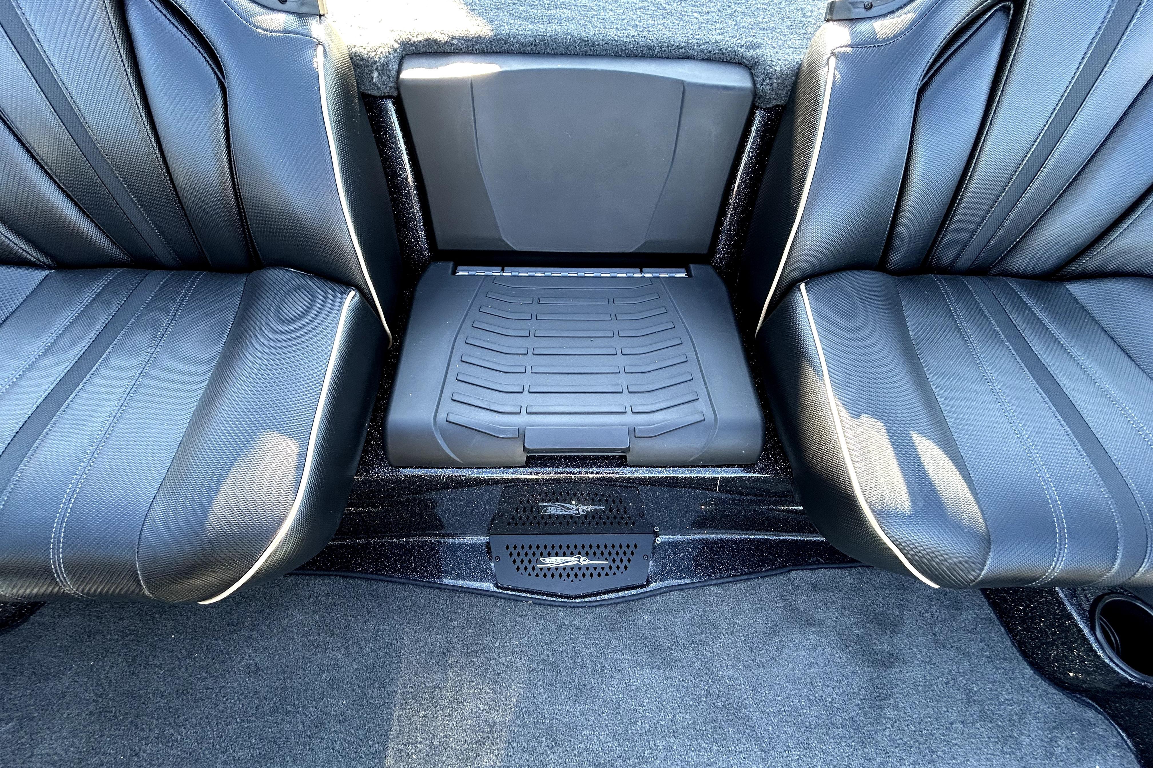 2026 Skeeter ZXE21 interior seating with black leather upholstery and center console.