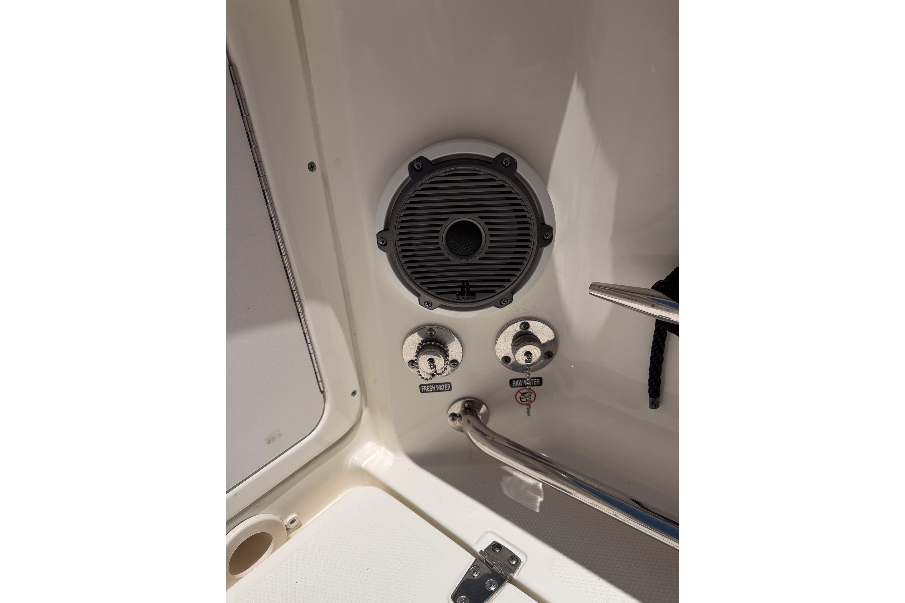 2021 Boston Whaler 330 Outrage boat speaker and water controls detail.
