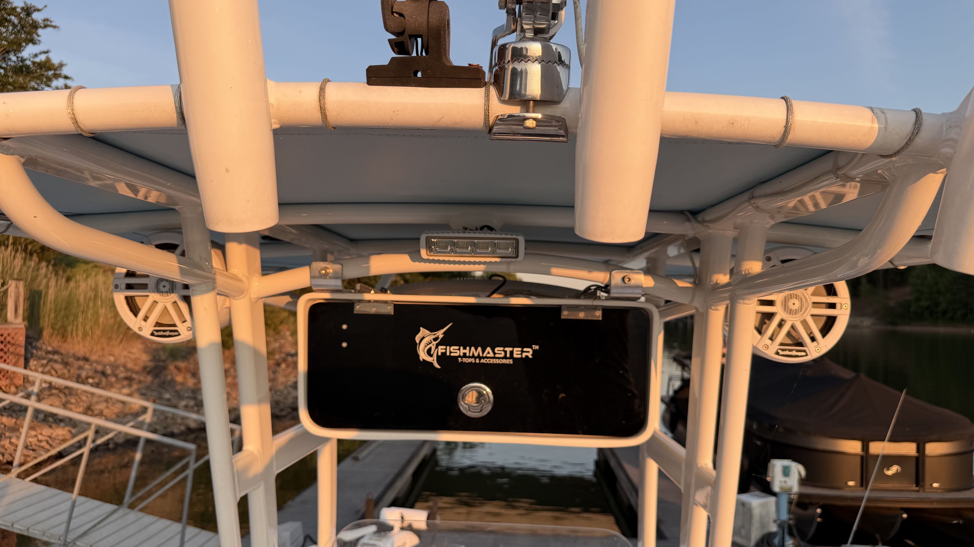 Close-up of the top section of a Yamaha 190 FSH Sport boat with speakers and accessories.