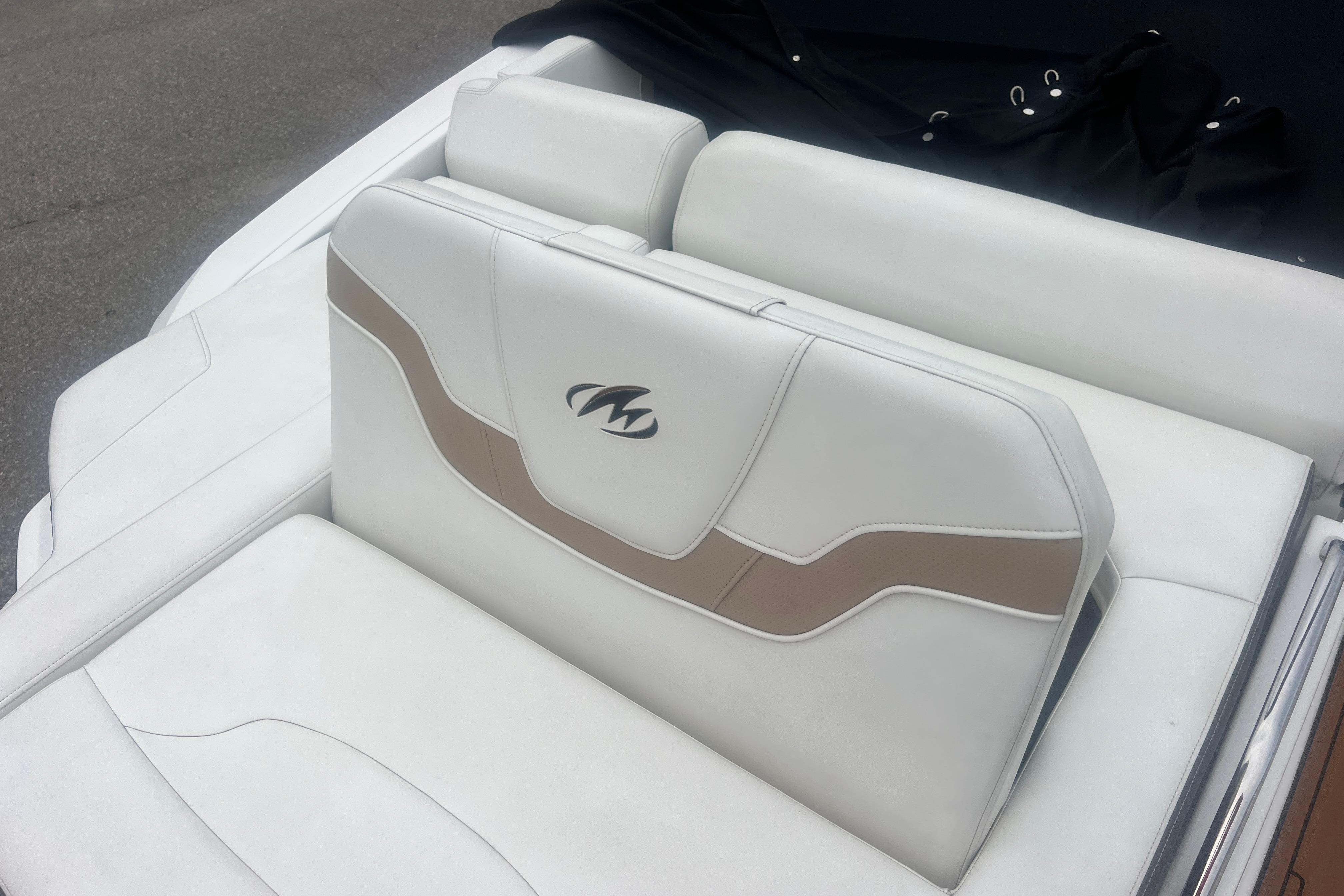 2017 Monterey 298SS Super Sport boat seat with white and beige upholstery.