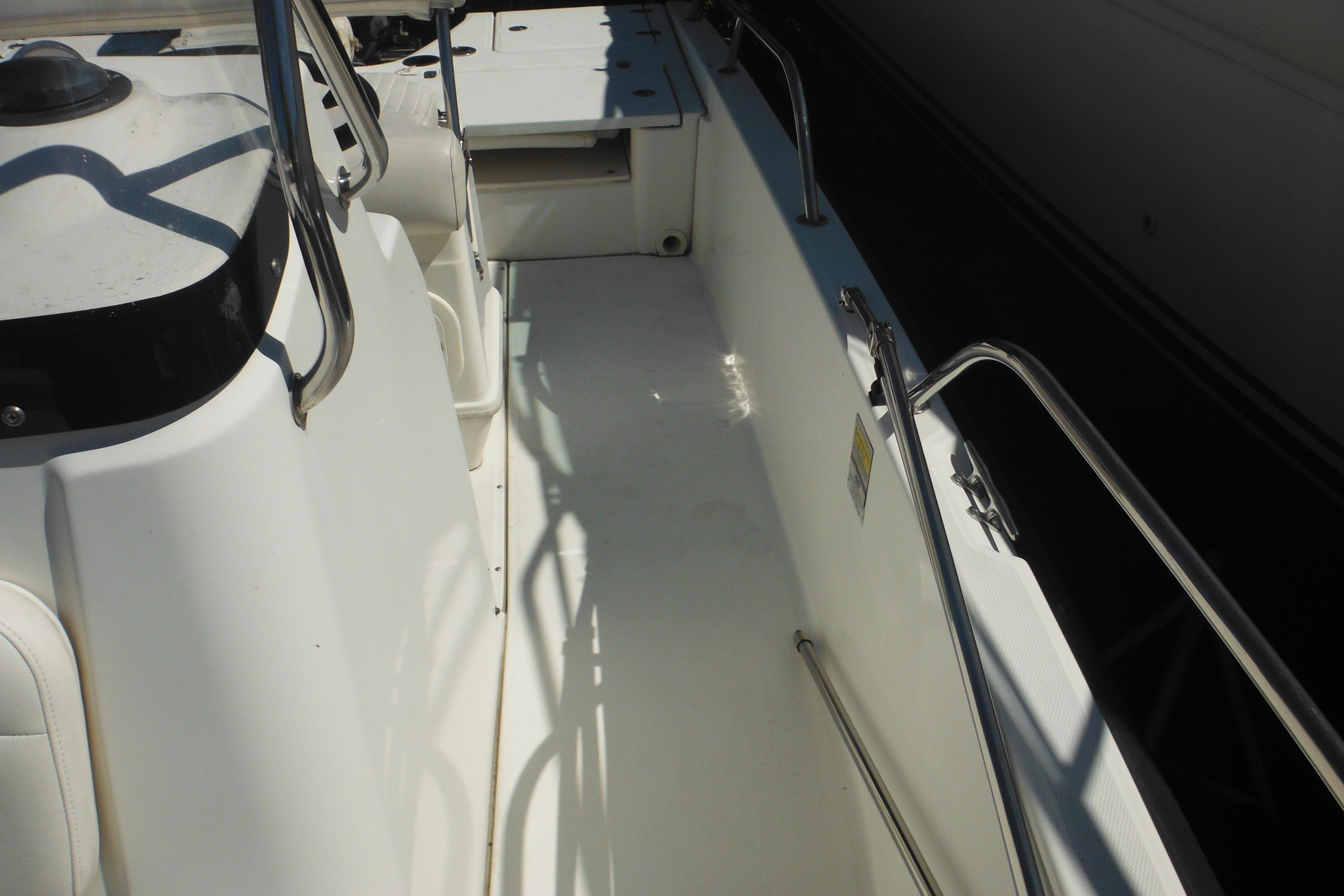 2009 Boston Whaler 200 Dauntless boat interior with seating and railings.