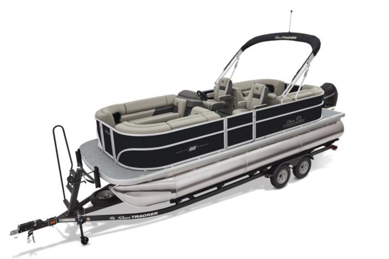 2026 Sun Tracker Party Barge 22 DLX pontoon boat on trailer, featuring spacious seating.