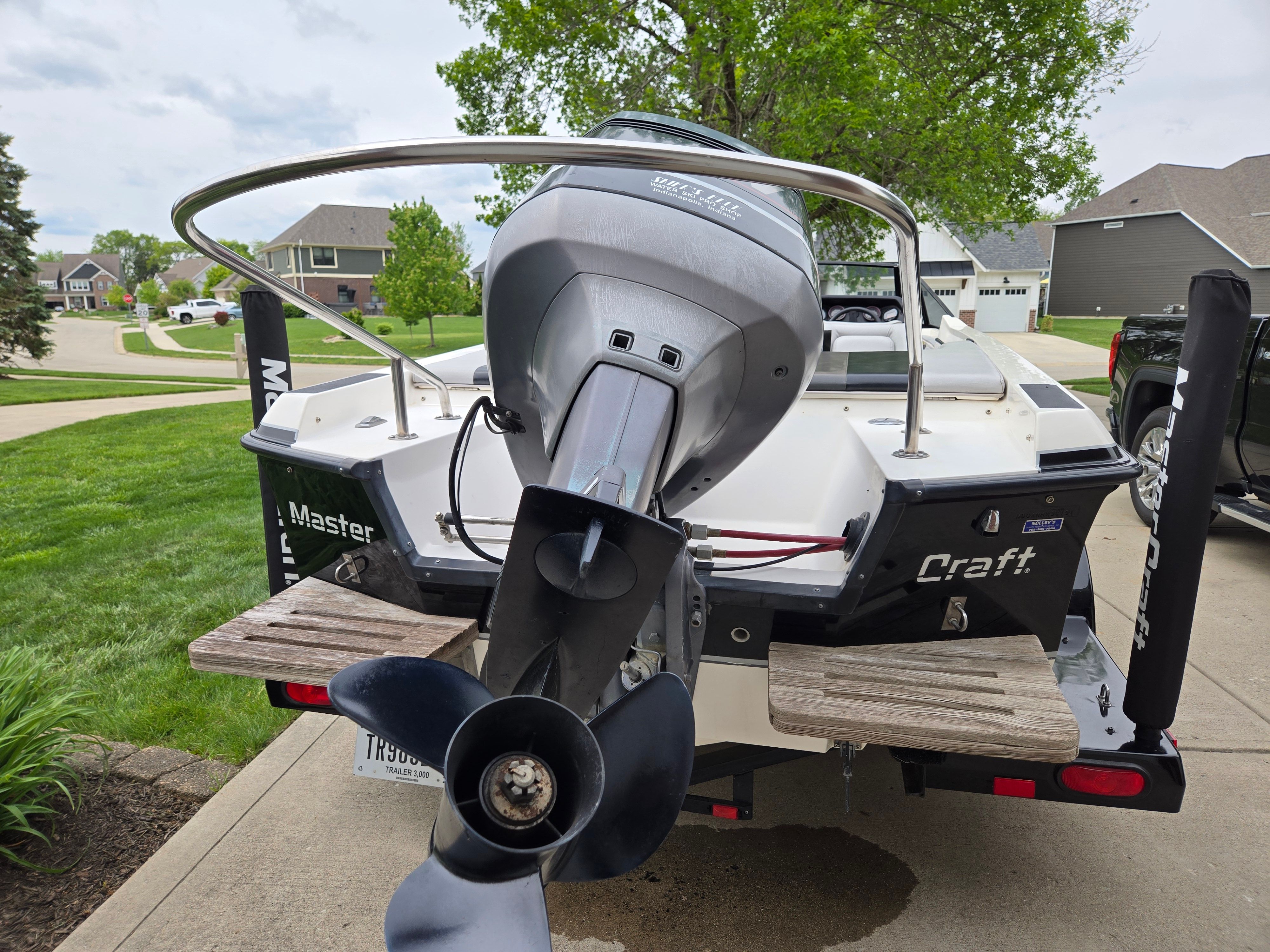1991 MasterCraft Barefoot 200 boat parked on trailer outdoors.