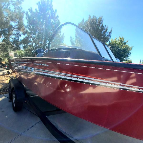 2024 Tracker Targa V-19 WT boat in red on a trailer.