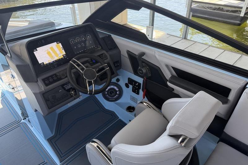 2026 Cobalt R8 Surf boat cockpit with modern steering and digital display.